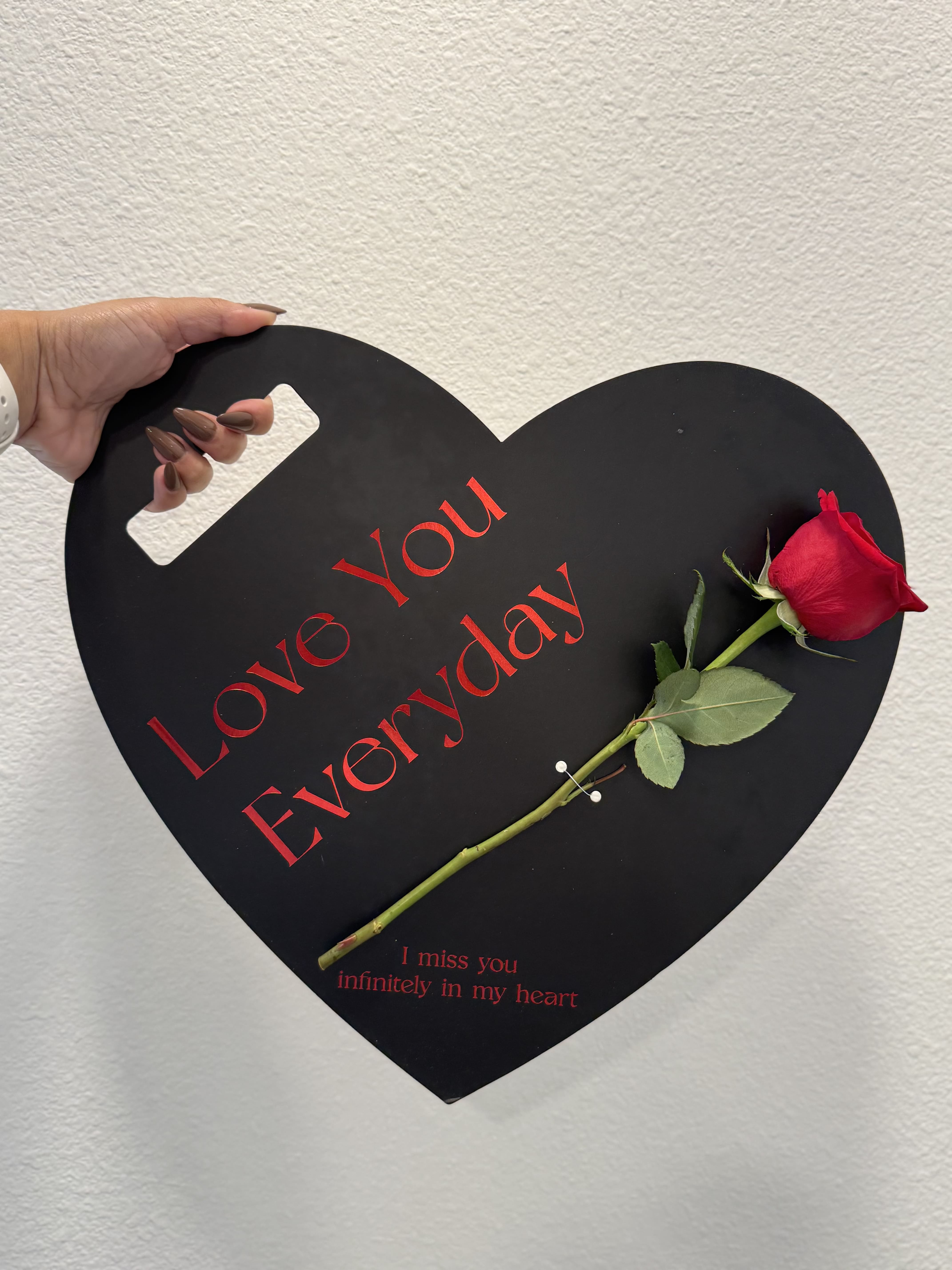 Corazon Negro - Black heart with a red rose.