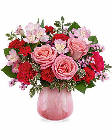 Sweet On Hue - Keep them blushing with the most beautiful pink Valentine's Day bouquet, elegantly displayed in a sculpted pink glass vase featuring a stunning pearlescent finish.