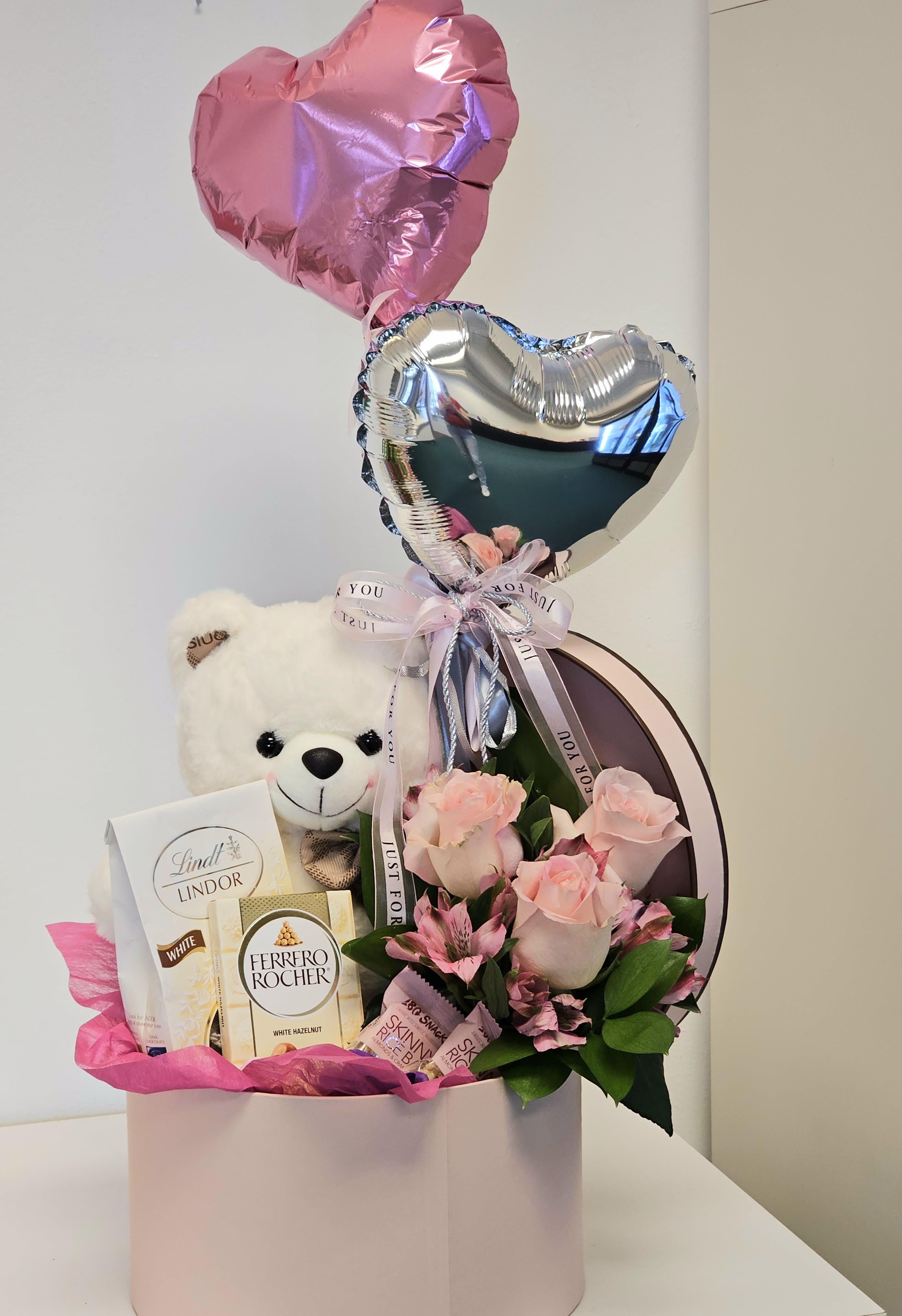Beautiful arrangement with bear and chocolates -  This Beautiful arrangement with bear and chocolates wonderful surprise for your loved one.  
