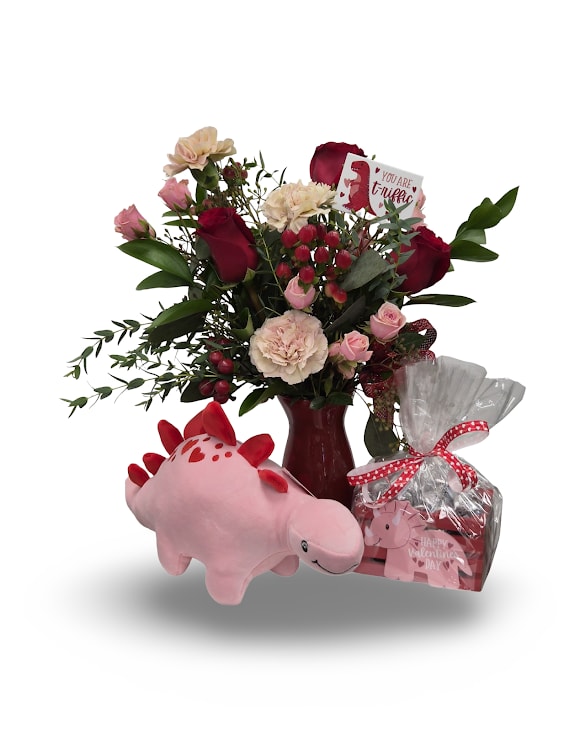 Love-O-Saurus Bundle - Love-o-saurus Bundle features our playful Love-o-saurus floral arrangement paired with a dinosaur plush and sweet treats for an extra fun surprise. Choose the Standard version if you’d like the pink dinosaur plush, or the Deluxe version for the red dinosaur plush. All other bundle items remain the same, making it easy to pick the perfect prehistoric love gift.  Includes: -Love-O-Saurus Arrangement -Decorative Dino Kisses -Dino themed plush  Note: Decorative Dino Kisses container may vary.