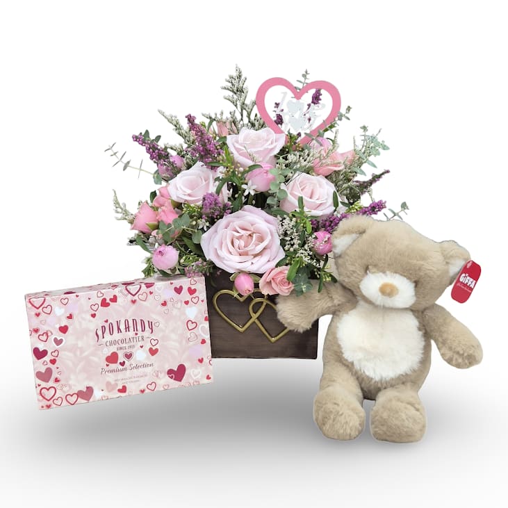 Perfectly Pink Bundle - Sweet, soft, and full of love. Our Perfectly Pink arrangement features delicate pink blooms paired with a cuddly bear plush and a box of chocolates, making it the perfect all in one gift to brighten their day and warm their heart.  Includes: -Perfectly Pink Arrangement -Valentines 8oz Chocolate  -10" Baby Bear Plush