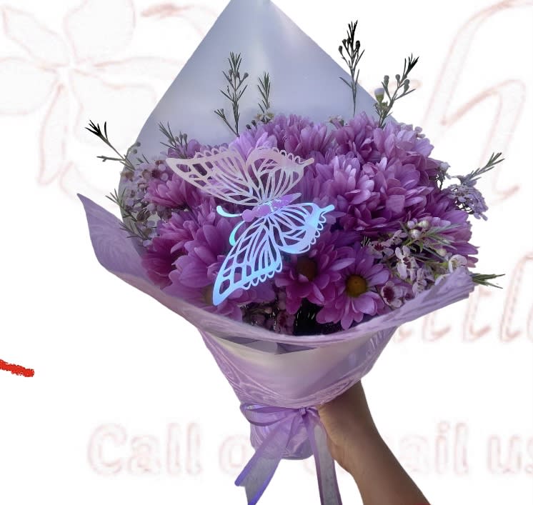Daisy Lavender Hand Wrapped Bouquet - Perfect for any person who's favorite flower is a lavender Daisy and for any special occasion. Wrapped in gift wrap or Parchment Paper and dressed with ribbon.