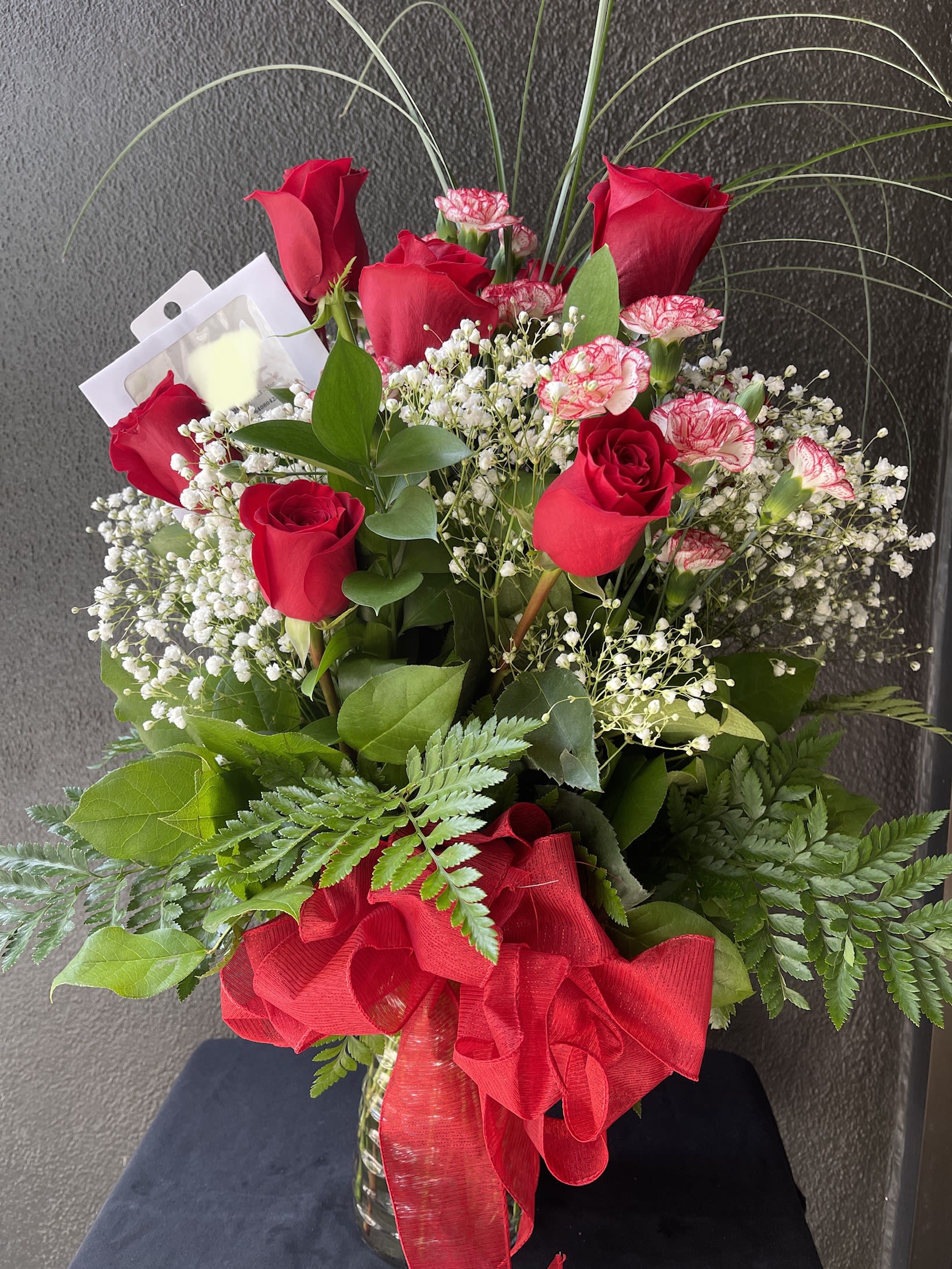 Dozen Red Rose in Glass BQ2301 - Bouquet style of 12 Red South American Roses arrange with greenery and filler( subject to change by season and availability)