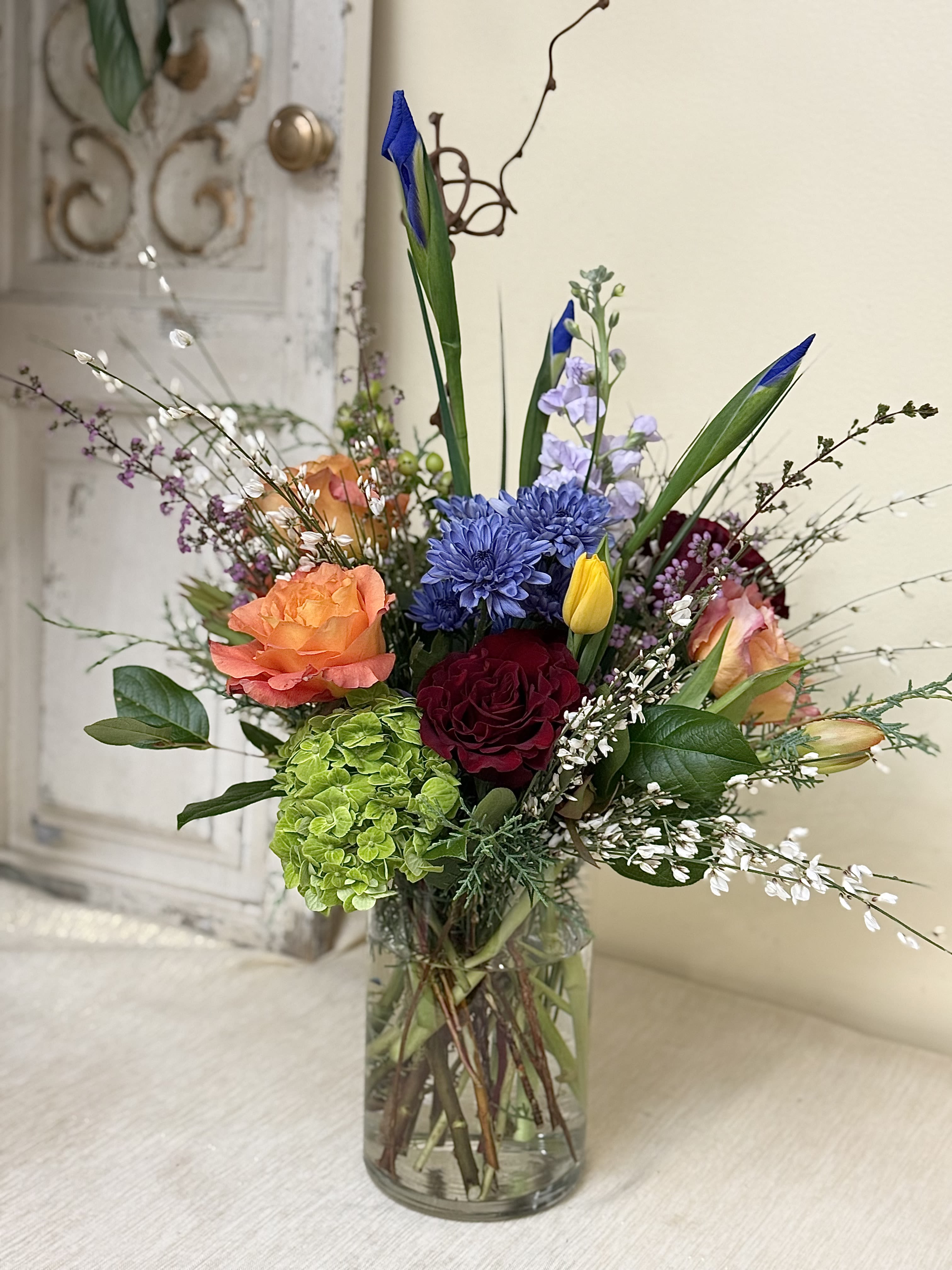 Passion with Color - A beautiful arrangement of color with a touch of our special red romantic roses, we add a textural element to it, pair this arrangement with one of our gifts for your special person