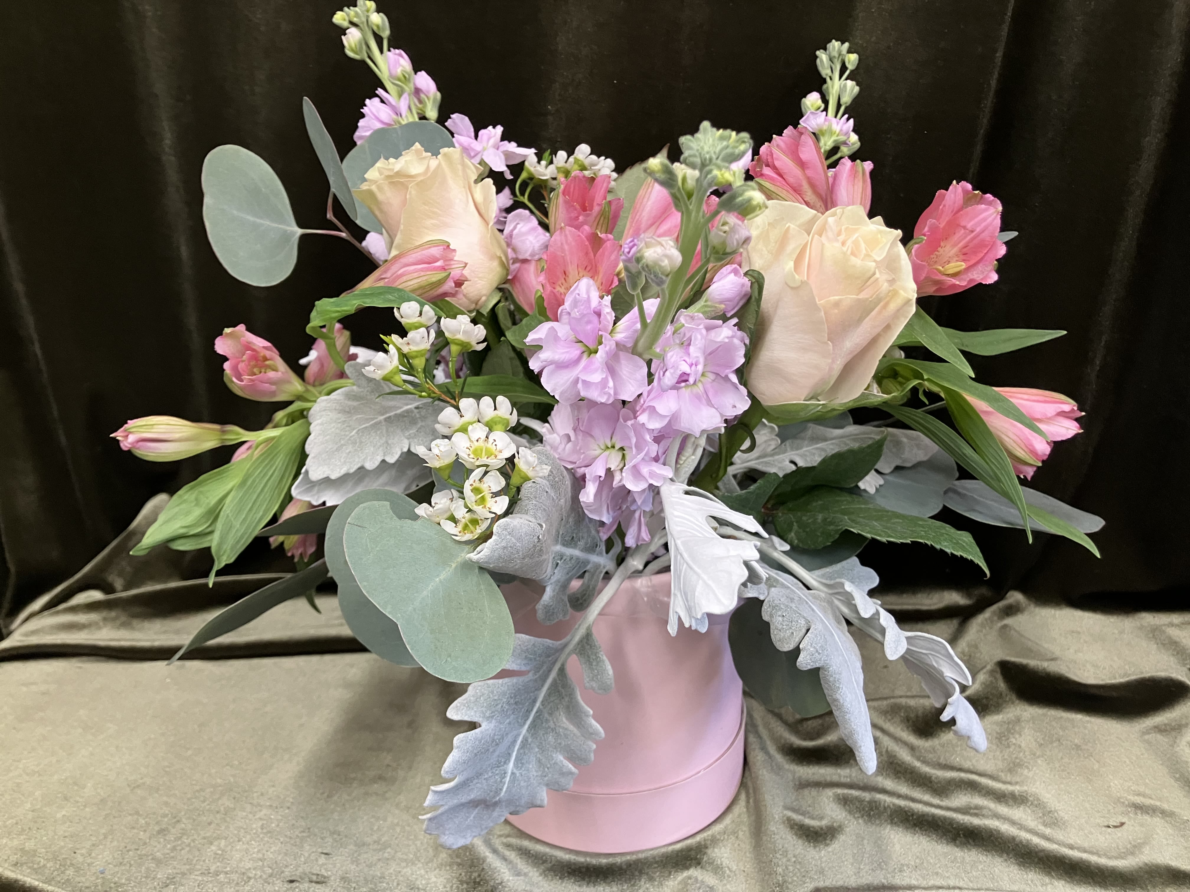 Brenda’s Pink Barrel Arrangement  - For the girls that love pink, here is a trendy arrangement of all pink flowers such as roses, fragrant stock, long lasting alstroemeria and soft dusty miller leaves and eucalyptus. All favorite flowers of the shop owner! 