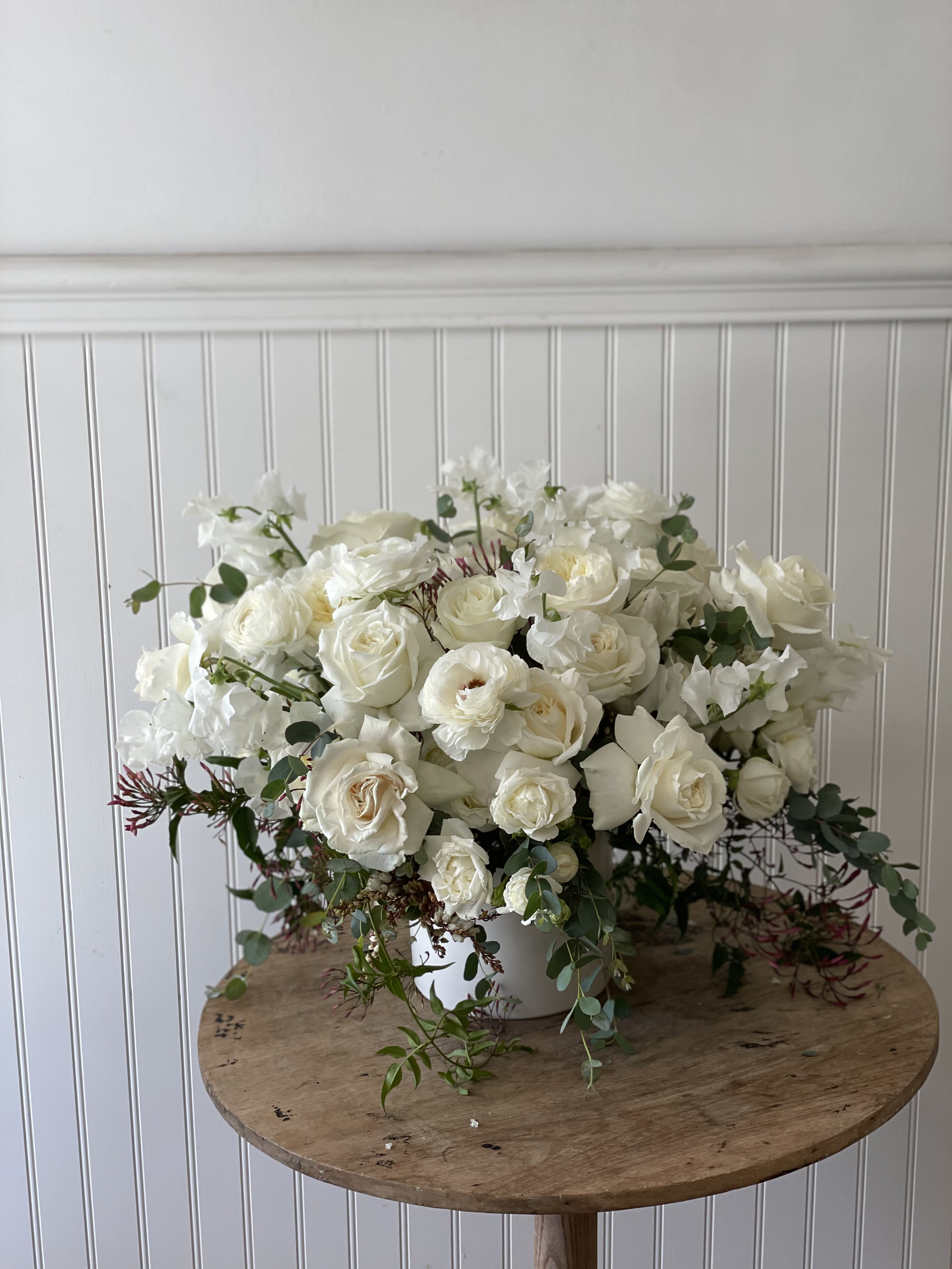 Designers choice -  All white flowers with soft green accents   A beautiful classic everyone can appreciate.  