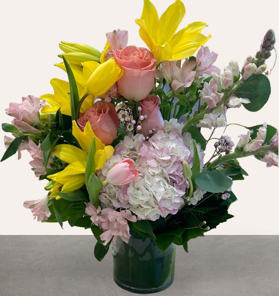 Yellow Lilies Tulips Hydrangea Modern Spring Garden Arrangement  - This modern spring garden arrangement  overflows with yellow lilies, tulips, hydrangea, roses and other fresh blooms to accent! Its sure to brighten up anyone's day with smile and a fresh floral scent! A wonderful gift to send to a friend or family member for a birthday, get well or anniversary.  