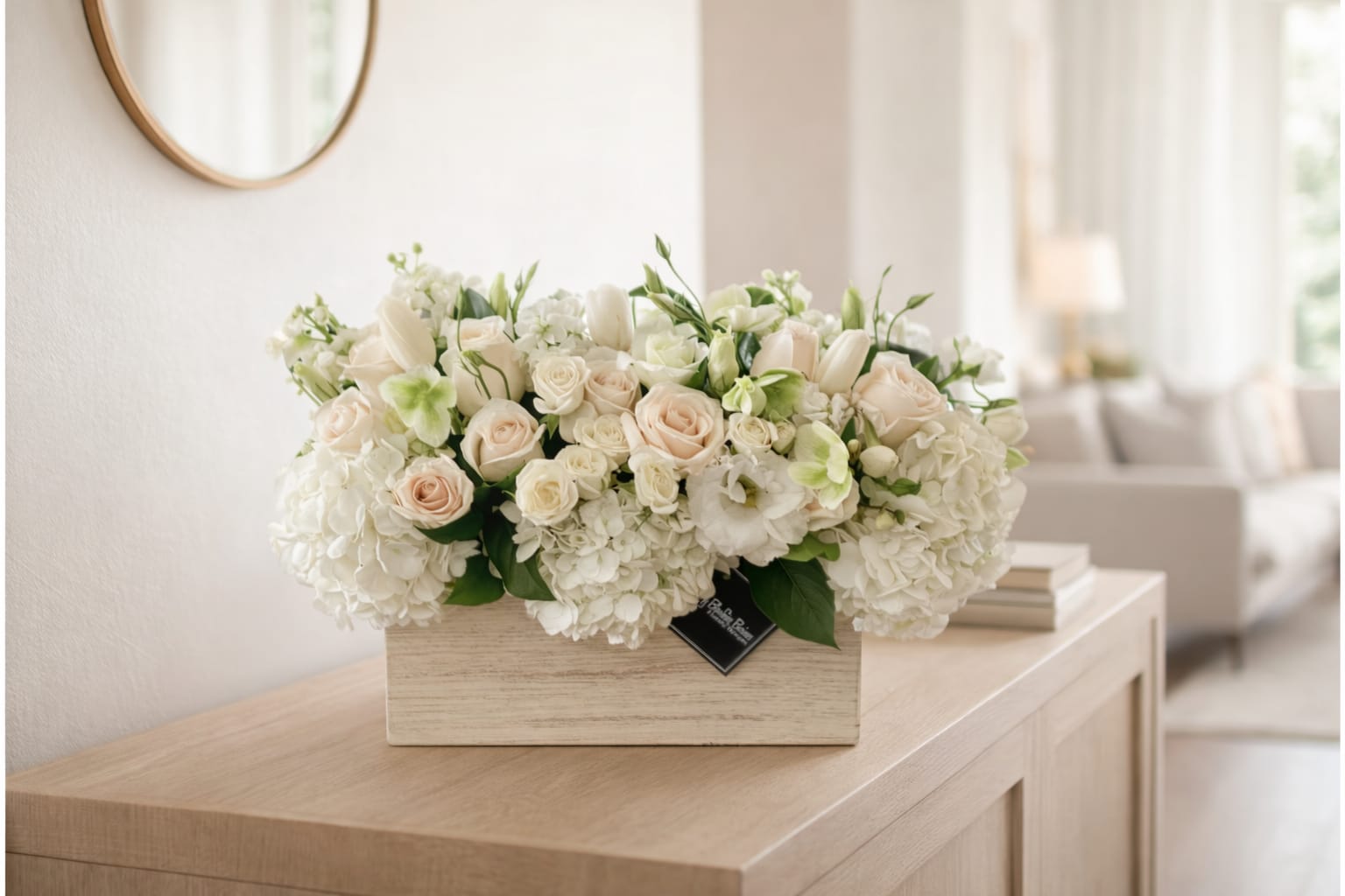 Giselle   - Giselle Arrangement by My Blooming Business   Elevate any space with the timeless elegance of the Giselle arrangement by My Blooming Business. Designed in a rustic whitewashed wooden box, this luxurious floral piece showcases a soft, romantic palette of creamy white and blush tones. Featuring lush white hydrangeas, delicate blush roses, lisianthus, ivory tulips, and hints of green, Giselle is the epitome of graceful sophistication.  Perfect for weddings, anniversaries, sympathy gestures, or upscale home décor, this low, elongated centerpiece brings refined beauty to any table or mantle.  Top-rated florist in Los Angeles, proudly serving Eagle Rock, Pasadena, Glendale, and the entire San Fernando and San Gabriel Valleys. Same-day flower delivery available across Los Angeles.  Order the Giselle arrangement today and let your sentiments bloom in style.