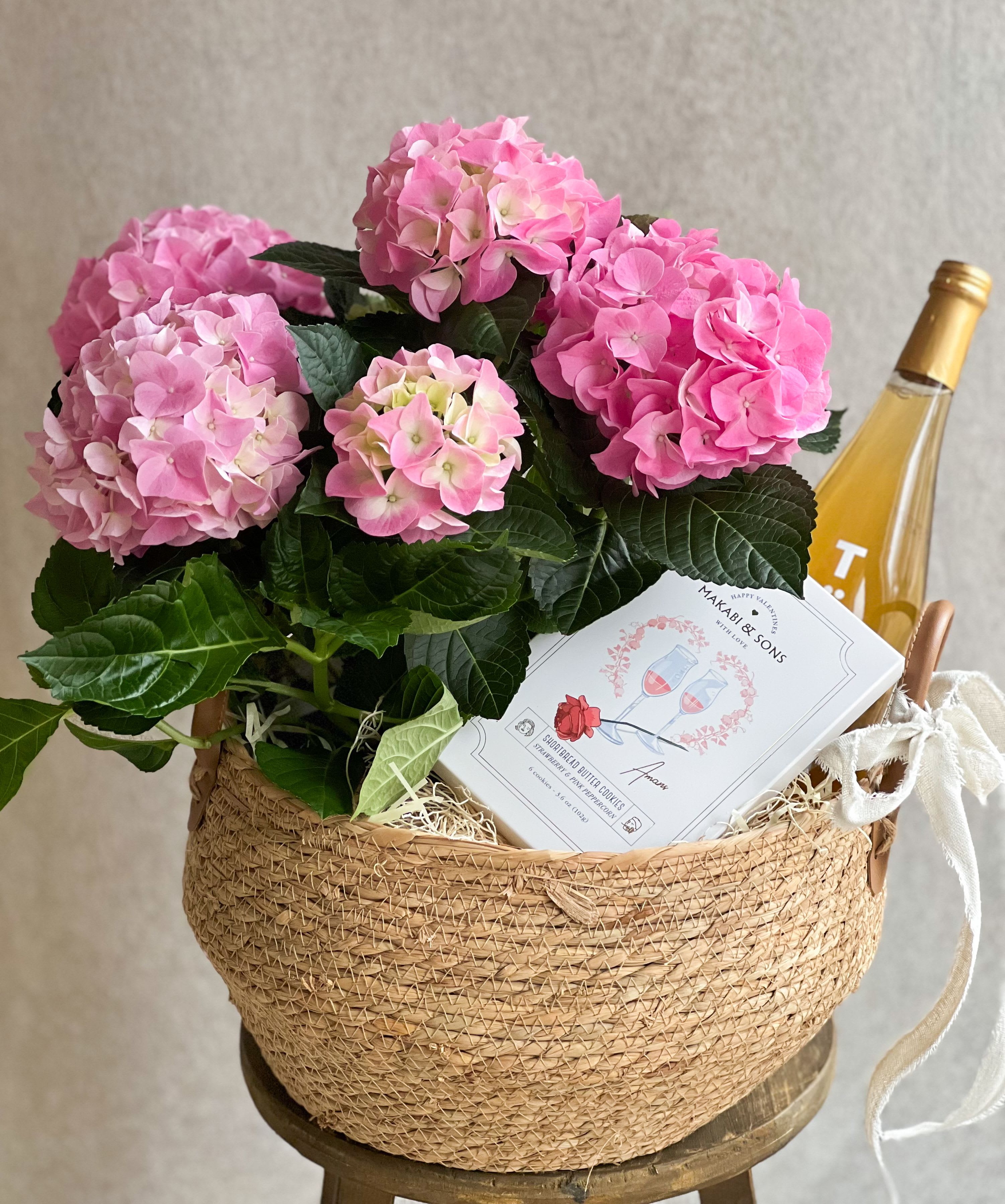 Fluffy Hydrangea Basket  - Fluffy Pink Hydrangea Potted Plant, in wicker basket, paired with a non alcoholic TOST beverage, and Shortbread butter cookies. Includes hand written card. 