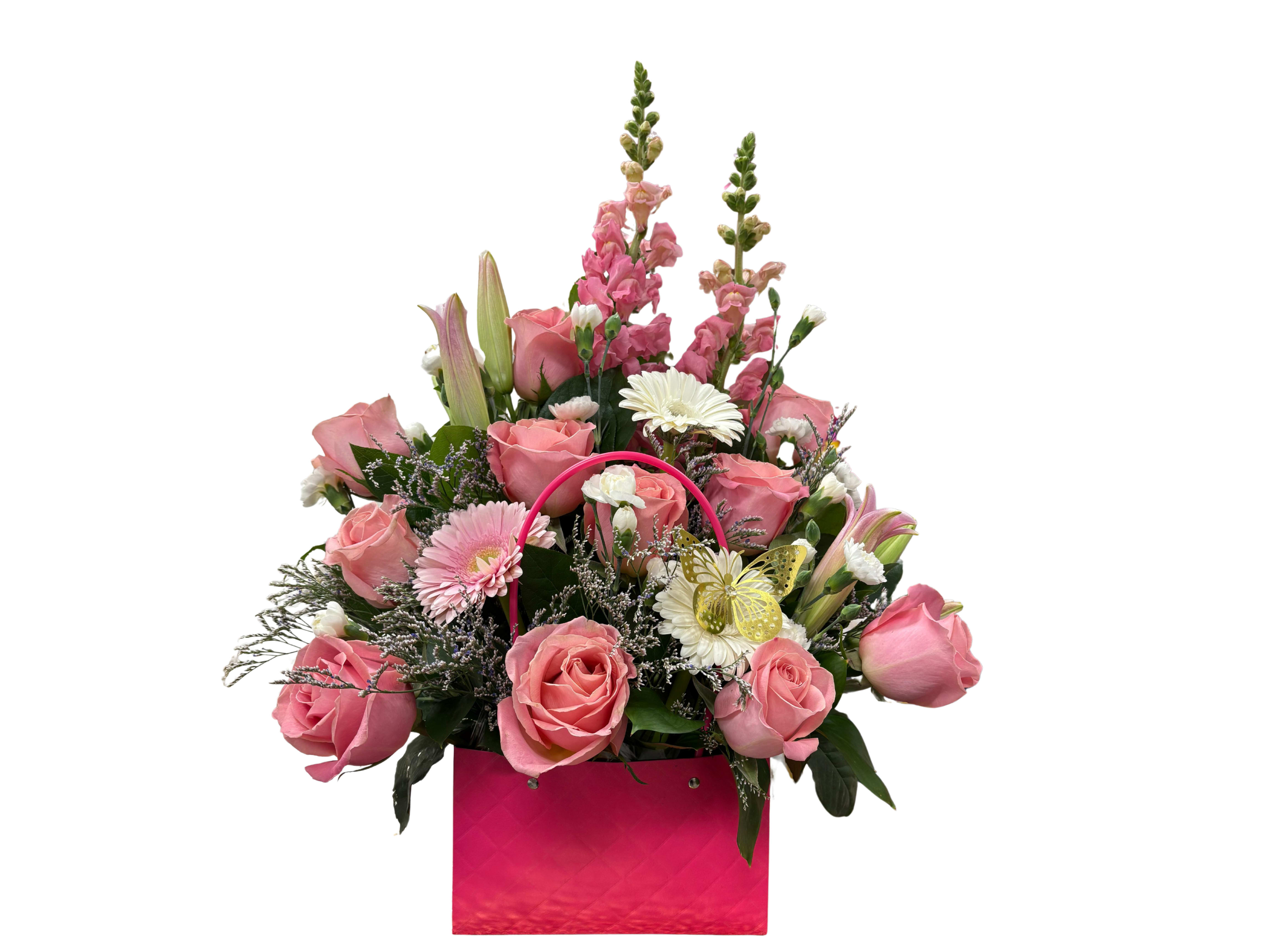Butterfly kiss ' A rose arrangement in a clutch bag featuring 11 light pink roses, three gerberas, limonium, mini carnations, and stock. - A rose arrangement in a clutch bag featuring 11 light pink roses, three gerberas, limonium, mini carnations, and stock. Gift her this perfect floral clutch for Valentine's Day—a thoughtful, loving, and elegant gift that will make her heart flutter.