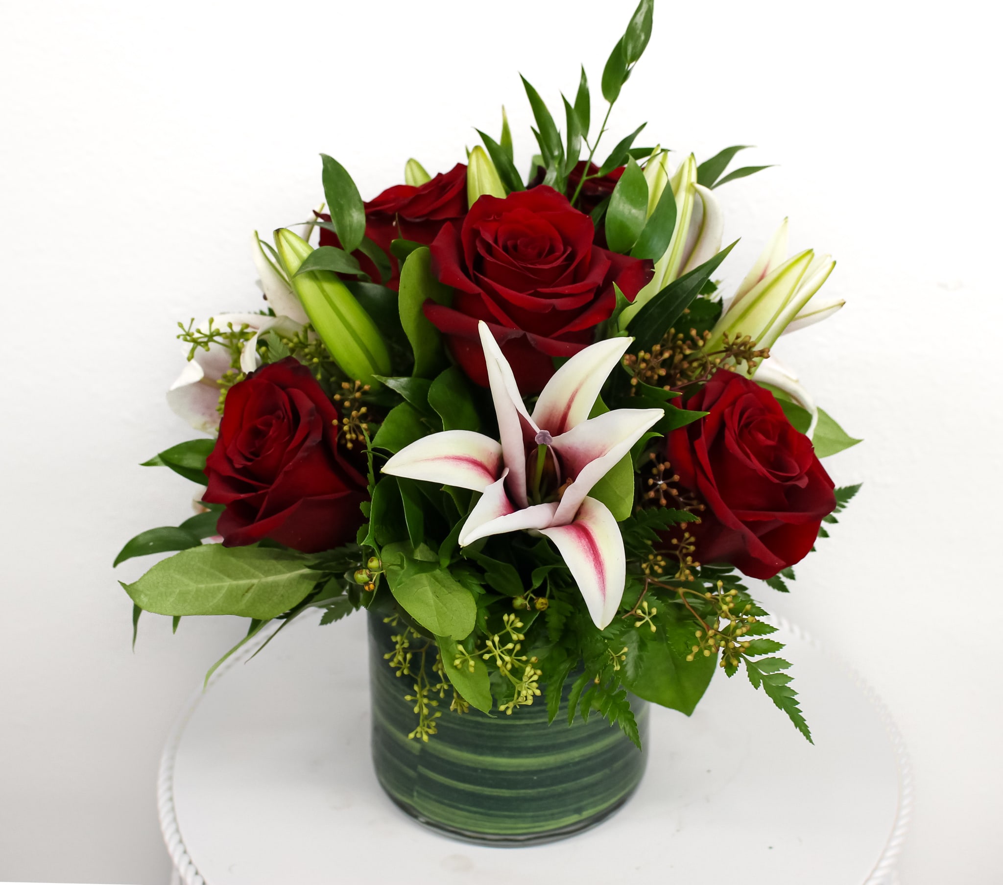 Star Gazing  - This compact design includes premium red roses and pink lilies. 