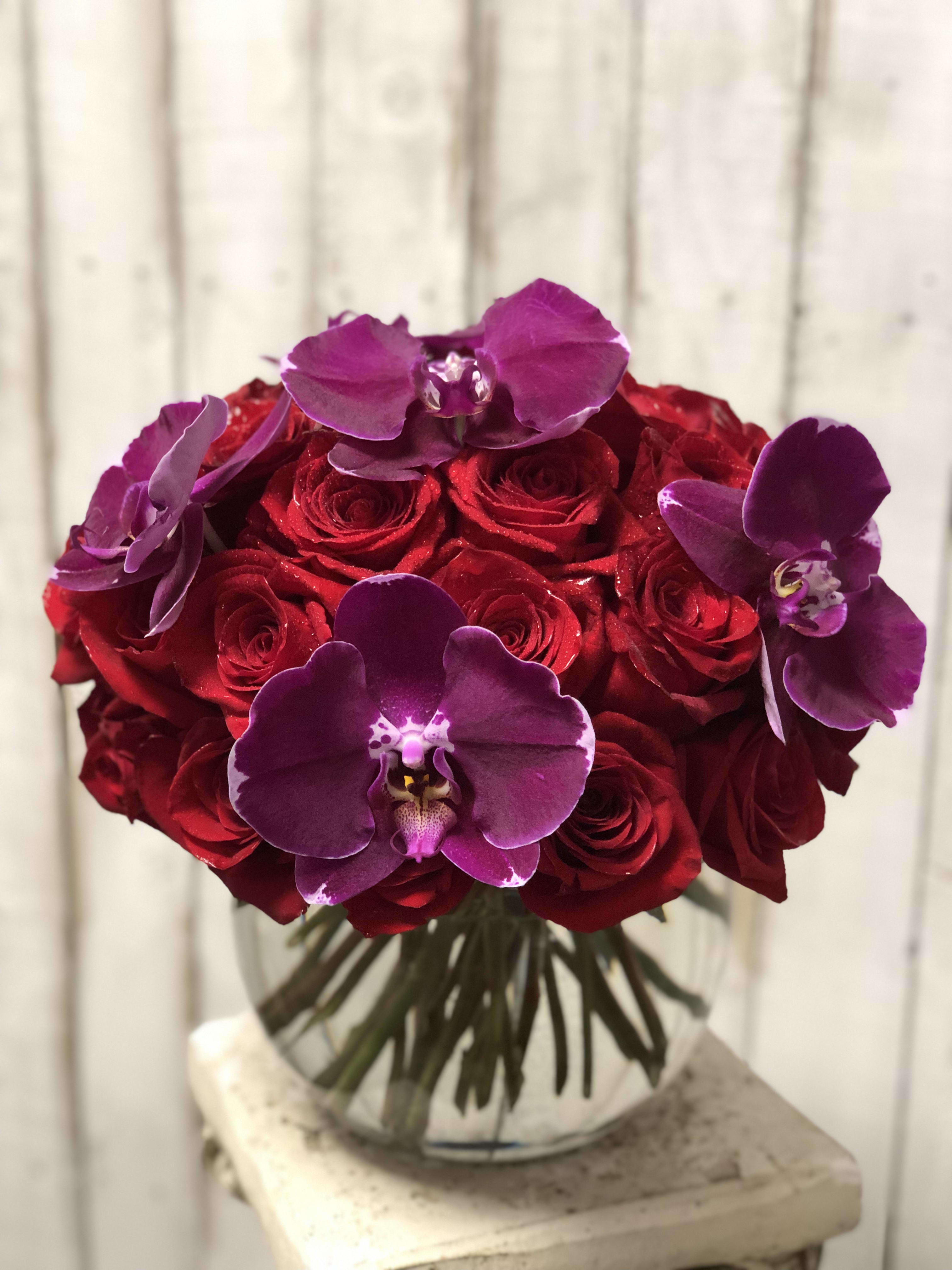 Just a Little Something - Say it all with Red Roses and purple orchids. Send your valentine, something different and unique for the classy lady in your life. This will definitely WOW  her.