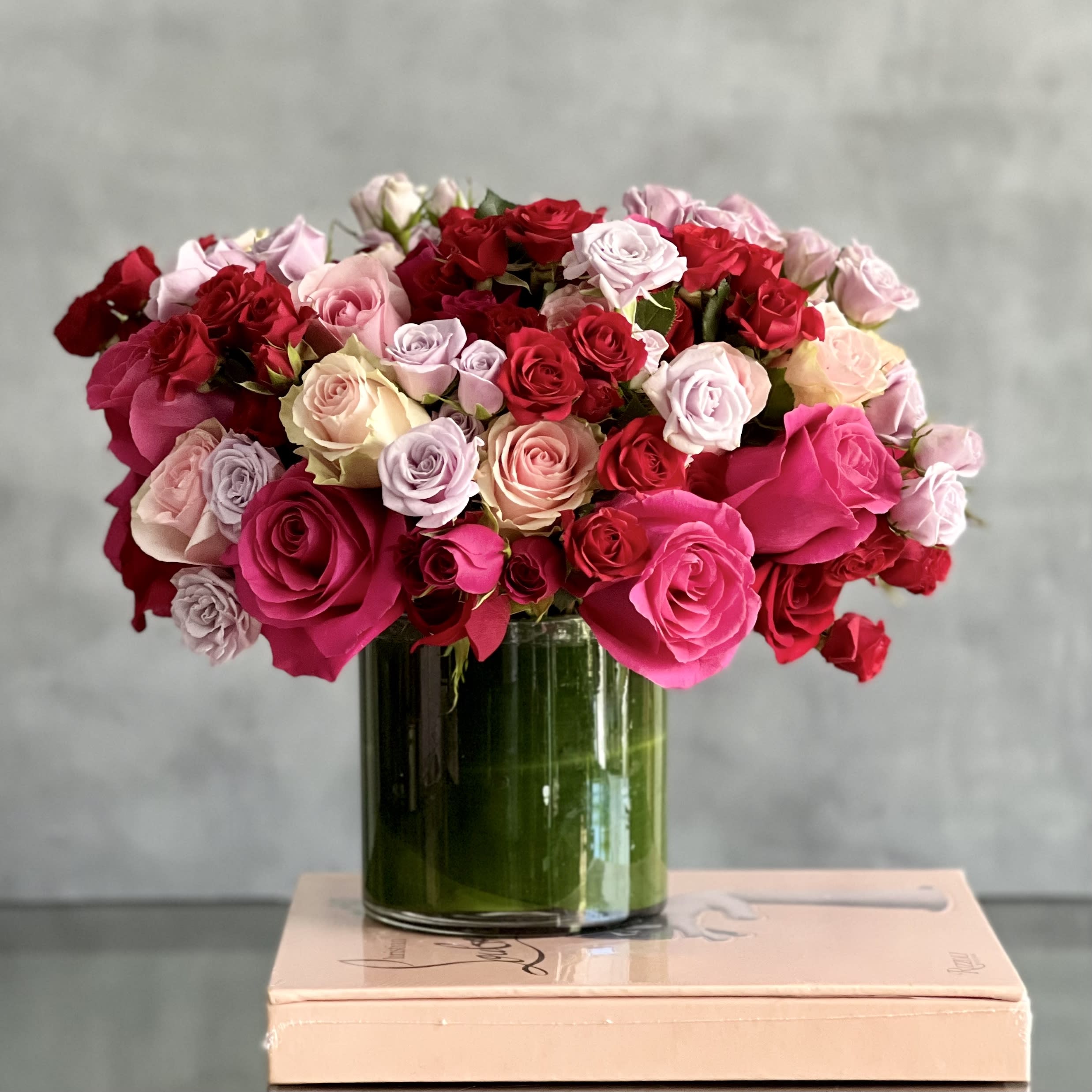 Summer Pinky Pinks - MBH - Beverly Hills Florist presents you with this beautiful array of over 50 blooms in various shades of pink in a leaf lined glass vase. It is ready for same day delivery and perfect for occasions for love and romance, anniversary, birthday, thank you, just because to that special someone.