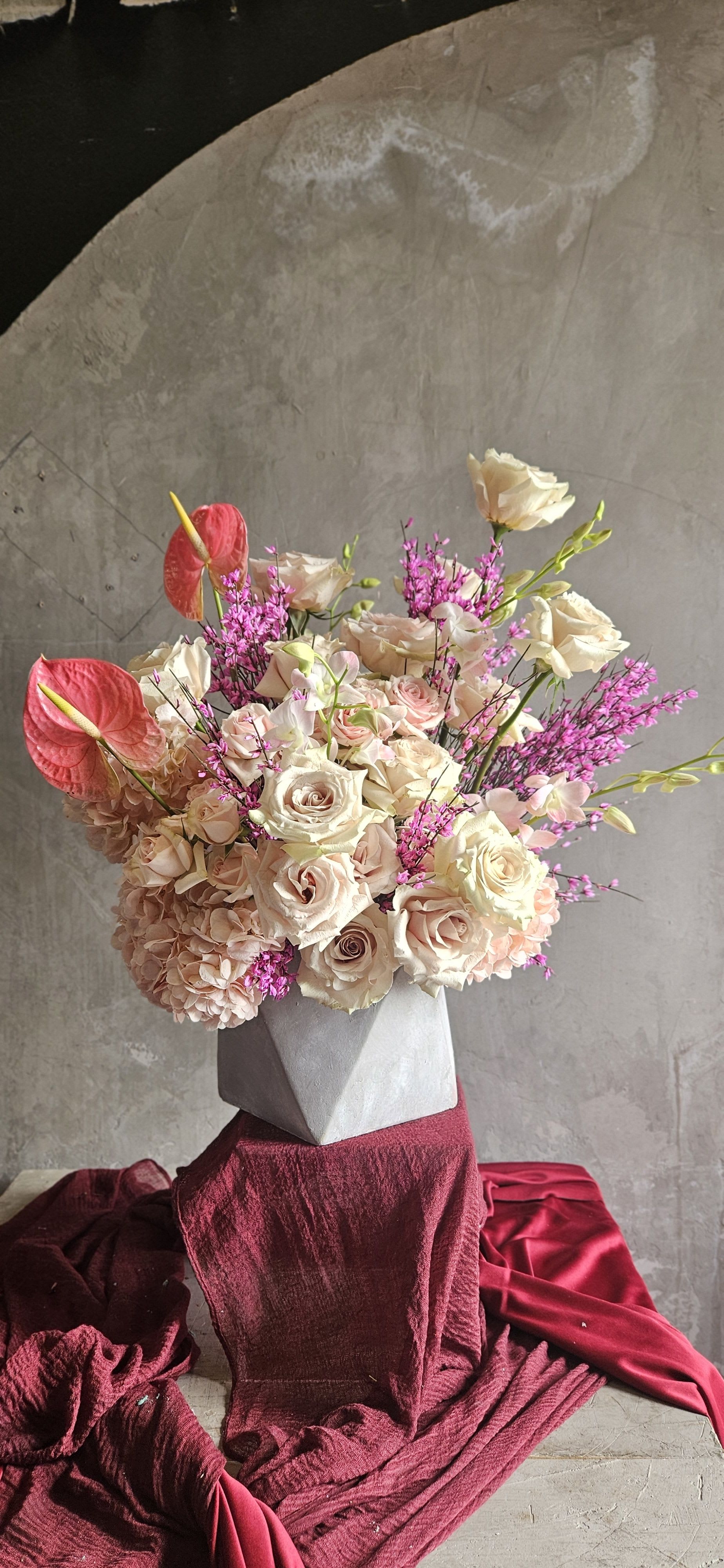 Blush &amp; Bloom Affair - A refined and romantic composition featuring premium champagne and blush roses, lush hydrangeas, elegant orchids, vibrant pink anthuriums, and delicate seasonal accents — artfully arranged in a modern geometric vessel.  Designed to embody soft sophistication with a bold contemporary twist, this arrangement is perfect for Valentine’s Day, anniversaries, or luxury gifting.