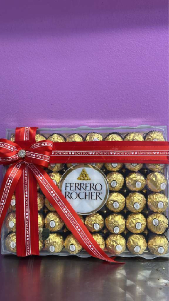 Chocolates Ferrero Rocher (Premium) -  Delicious hazelnut chocolates with a crispy shell, smooth chocolate coating, and creamy center. The perfect sweet and elegant add-on to complement your floral gift.