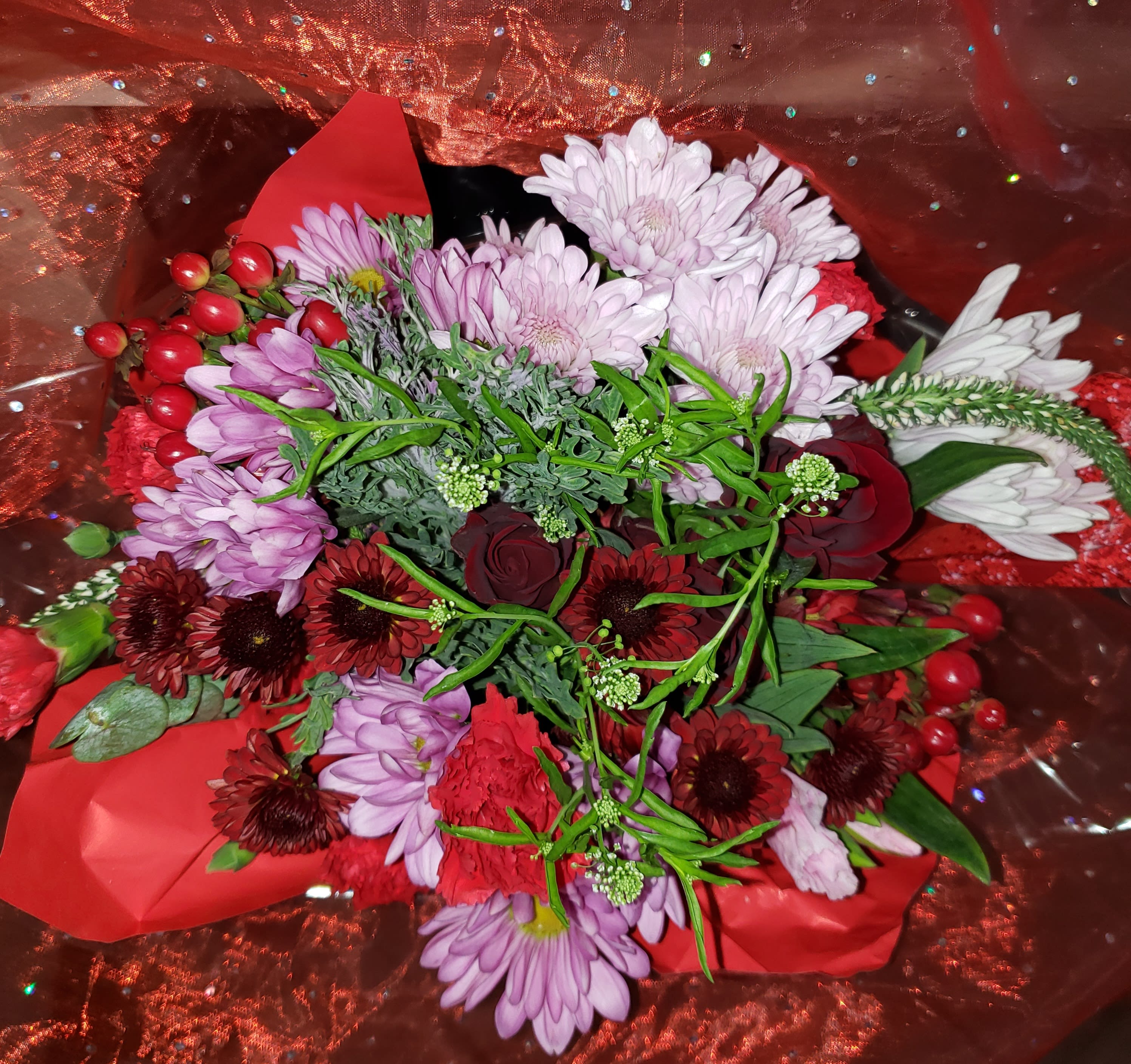  Cupid Hugs  - Availability on February 9th-16th while supplies last!  -LIMITED IN THIS STYLE &amp; COLOR THEME at times! IF we sell out on this selection, please take note of our substitution policy. Thank you!  Wrapped bouquet of fresh cuts and NO vase or container.  Similar variety of flowers and colors as shown in vendors photo.