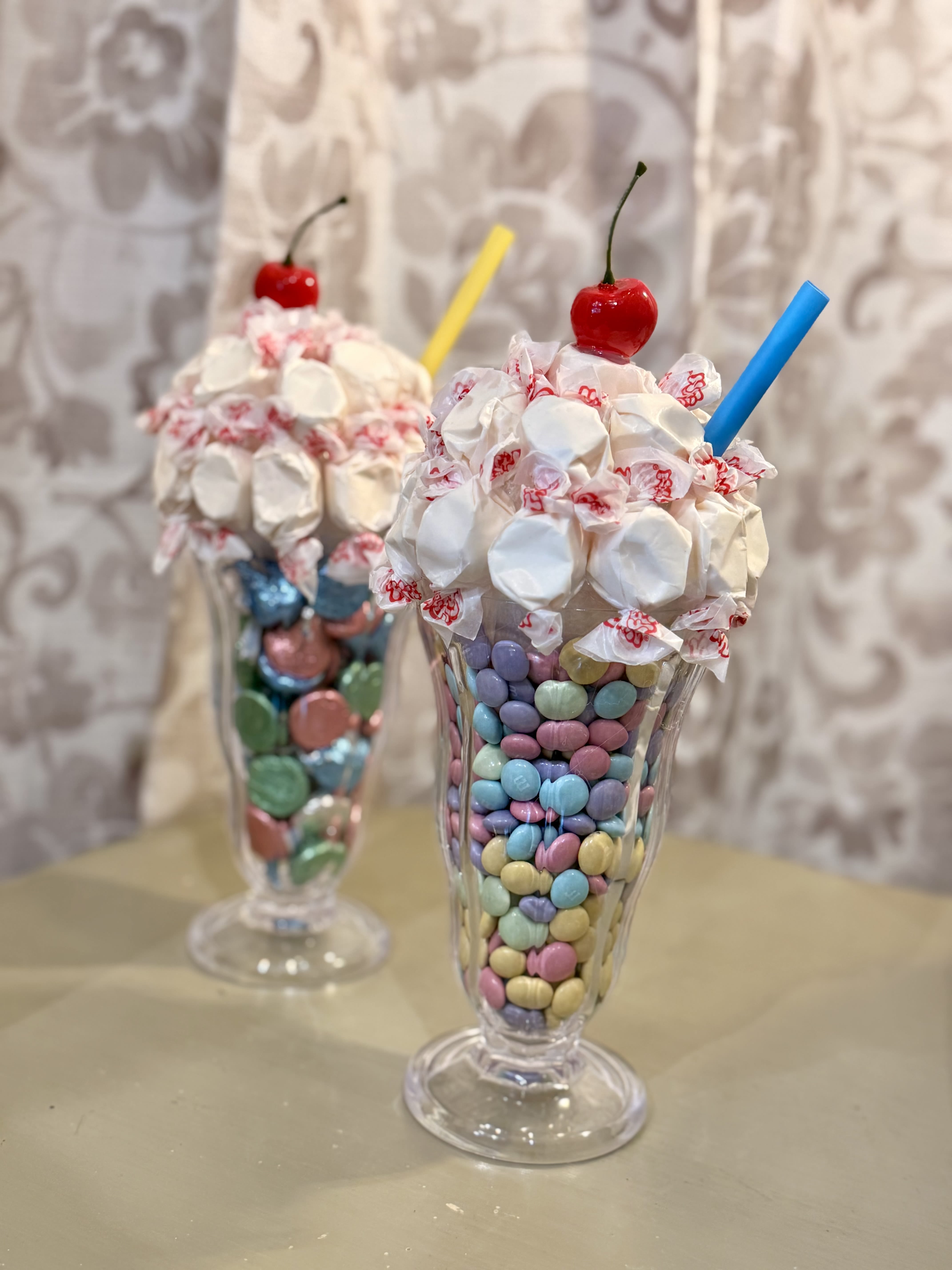 Sweet Treat Sundae Cones - Looking for a fun way to sweeten someone’s day? Our new Sweet Treat Sundae Cones are bursting with fresh candy and chewy taffy, all served in a colorful, decorative sundae cup that’s as fun as it is delicious! Perfect for kids, parties, gifts, or just because  These adorable treats are guaranteed to bring big smiles and even bigger sweet cravings!