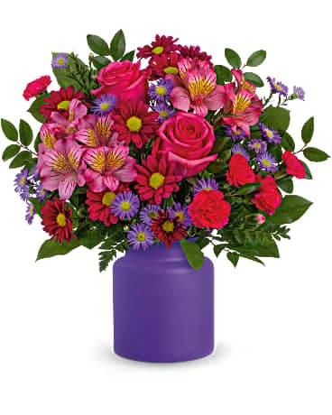Teleflora's You're Brilliant Bouquet - A bright, brilliant surprise, this hot pink bouquet and frosted glass jar make a bold impression on any occasion! This arrangement includes hot pink roses, pink alstroemeria, hot pink miniature carnations, purple daisy spray chrysanthemums, large purple monte cassino asters, leatherleaf fern, lemon leaf and huckleberry. Delivered in Teleflora's Savannah Jar.