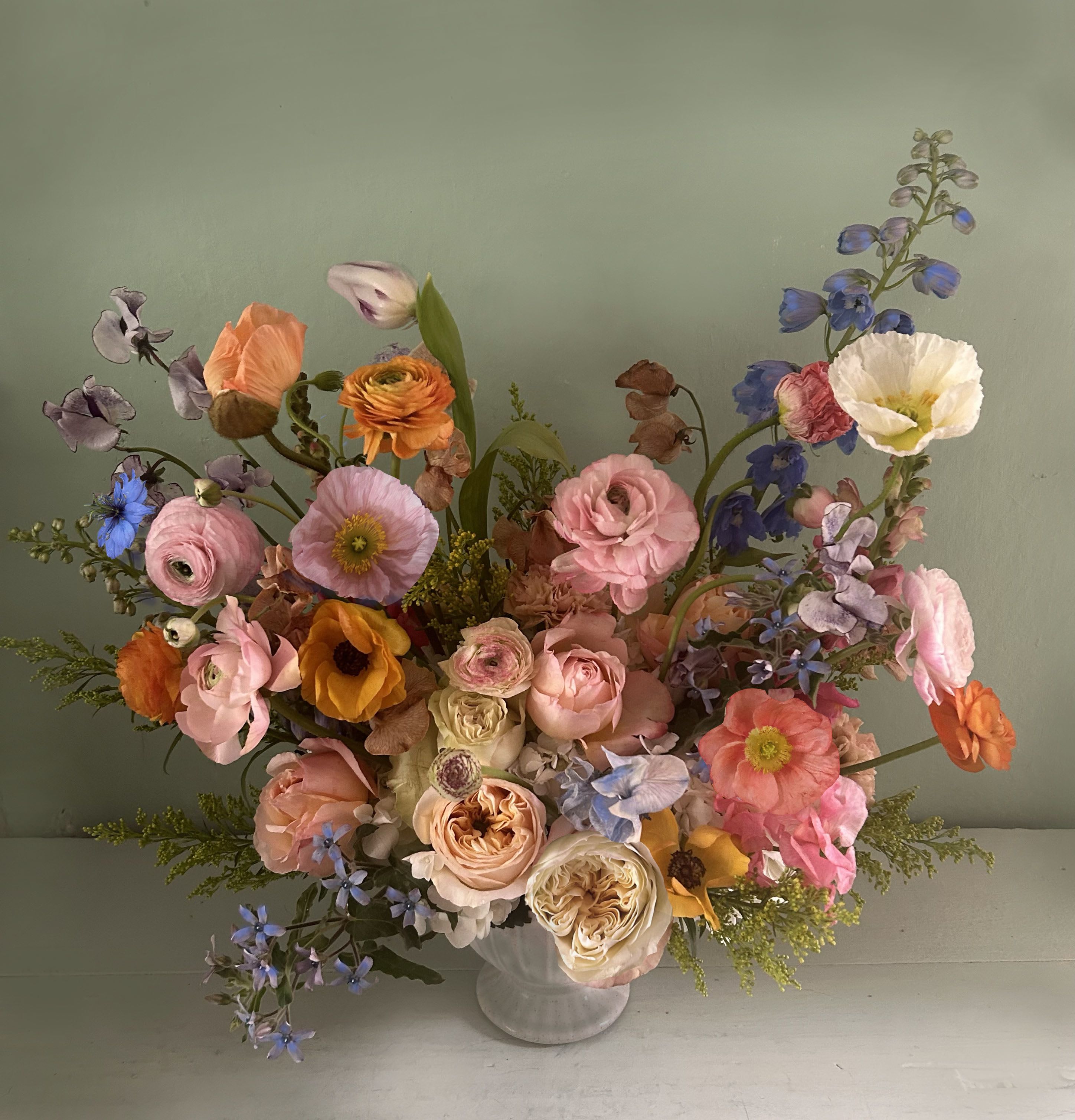 The Renaissance - A timeless, classic floral arrangement inspired by the Dutch Flower paintings. Elegance and extravagance with a touch of whimsical English garden, designed to inspire and light up in any room, always with a beautiful and natural scent of floral garden - arranged in a pedestal container, containing seasonal stems of natural, high quality flowers like Delphinium, poppies, ranunculus, garden roses etc. This luxurious and unforgettable arrangement is ready for hand delivery in LA 