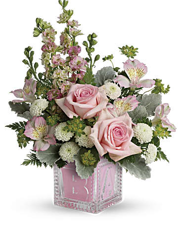 Teleflora's Bundle Of Joy Bouquet - Welcome the new addition with a charming glass baby block keepsake, bursting with a sweet pink bouquet of roses, mums and delphinium. Pink roses, pink alstroemeria, white cushion spray chrysanthemums, and pink larkspur are accented with bupleurum, dusty miller, leatherleaf fern. Delivered in an adorable Baby Block.