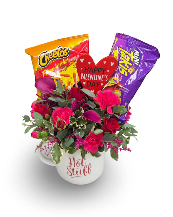 Hot Stuff - Hot Stuff is a fun and bold arrangement featuring vibrant blooms, a small bag of Hot Cheetos and Takis, all styled in a keepsake “Hot Stuff” mug. Measuring approximately 10 x 5 inches, this sweet-and-spicy gift is perfect for someone who loves a little heat.