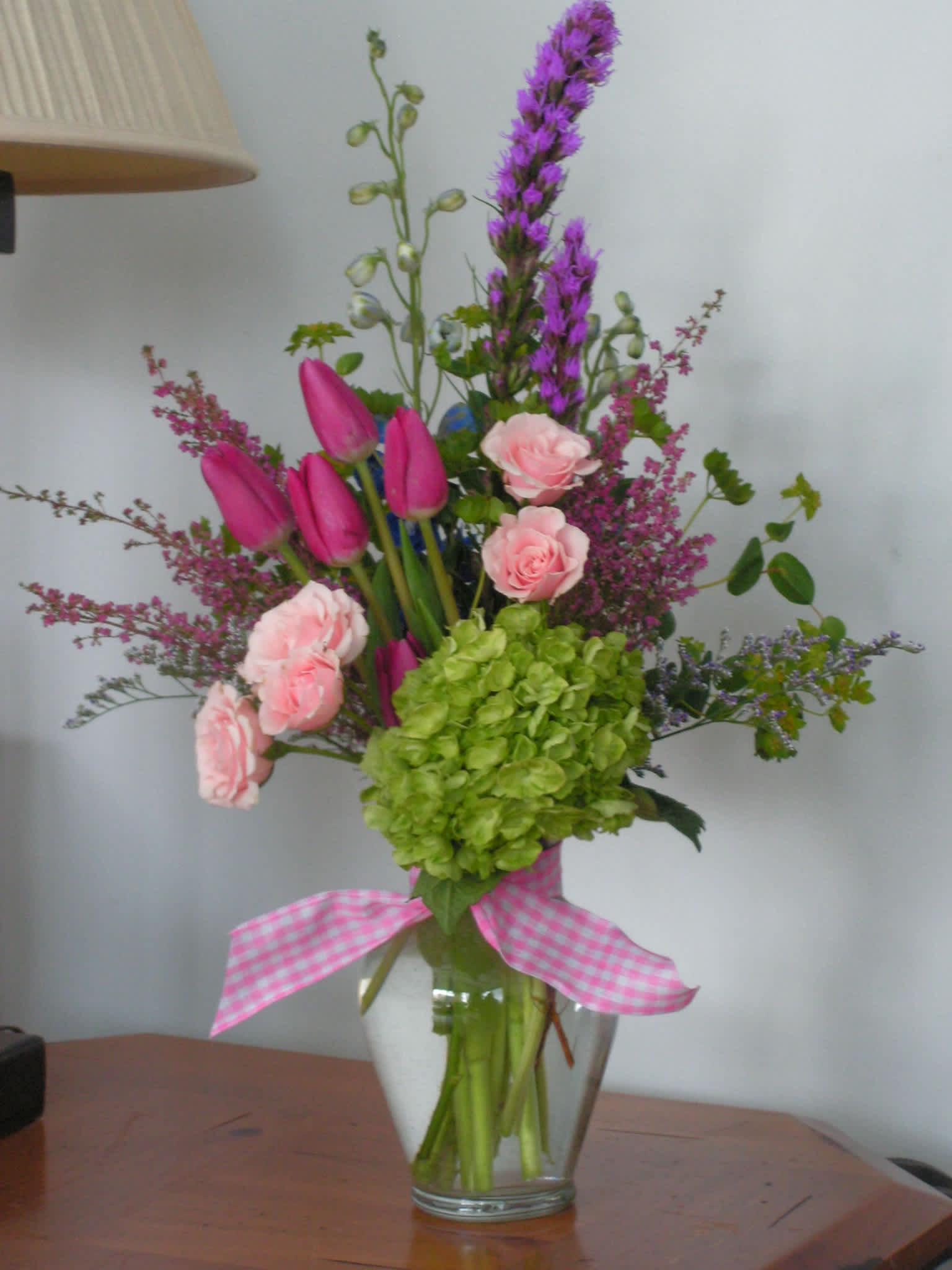 Spring Fling - The best of spring! Pink Spray Roses, Hydrangea, Perky Tulips, and heather make a beautiful spring arrangement. 