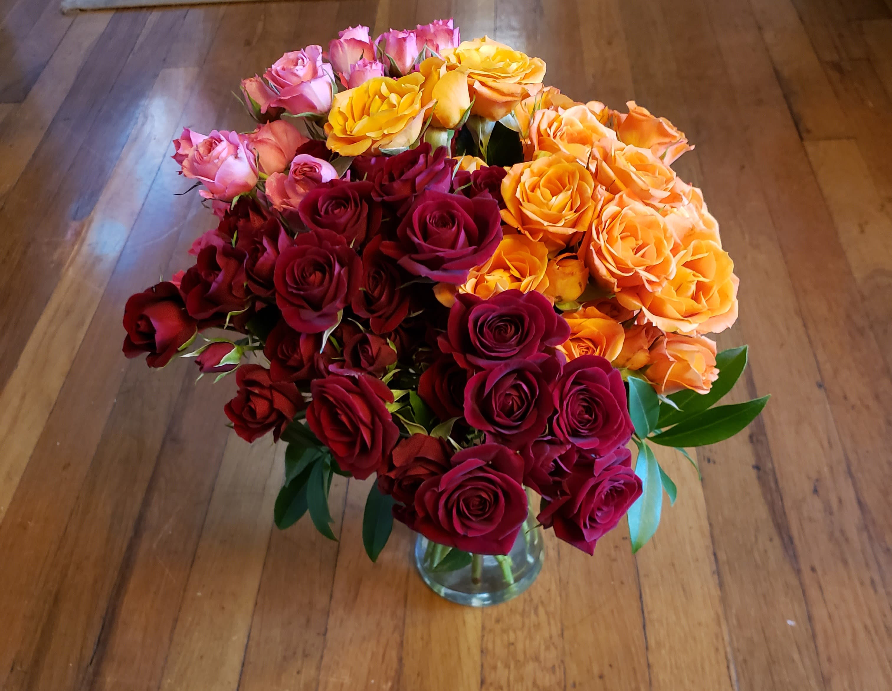 Winter Monel of Roses - an Winter Monet of Roses designed in a clear glass vase 