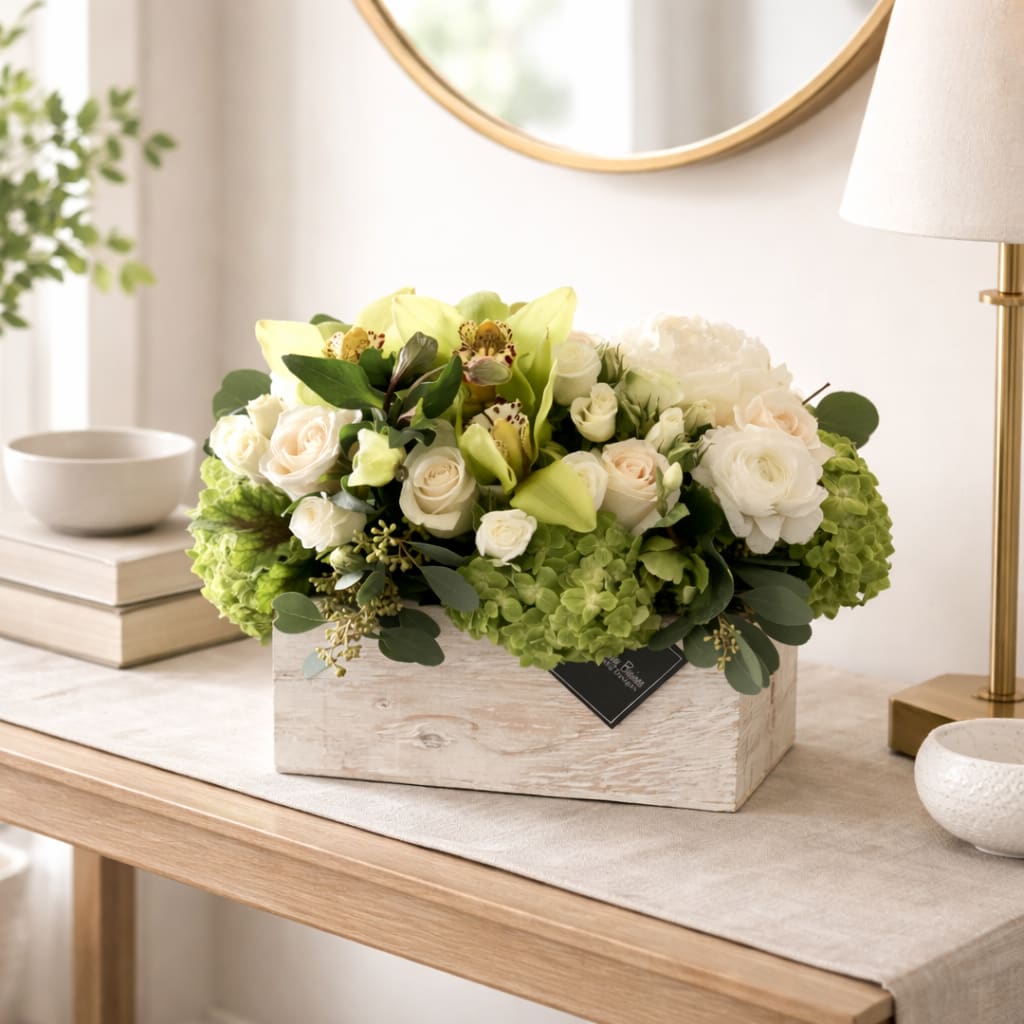 Mojito  - Picture this: a wooden white wash box, brimming with the most pristine white hydrangeas, delicate white roses, and exotic green orchids. It's like a miniature oasis, transported straight from a Cuban paradise. With the Mojito in hand (well, in a box, but you get the idea), you have the power to elevate any occasion to new heights of sophistication and pizzazz. 