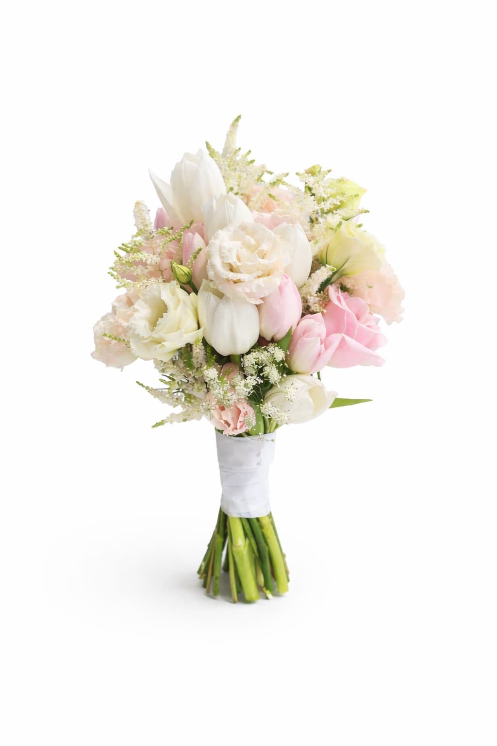 Custom Bridal Bouquet – Soft Blush Elegance | ÂmFleur Luxury Wedding Collection - A delicate and timeless bridal bouquet inspired by French romance and Parisian elegance.  Designed with soft blush roses, creamy white tulips, lisianthus, and airy seasonal florals, this bouquet embodies grace, femininity, and modern sophistication. The composition blends gentle pastel tones with refined textures, creating a harmonious and luminous silhouette — perfect for a romantic wedding celebration.  Each bouquet is handcrafted at our Covina studio by ÂmFleur designers using fresh, premium seasonal blooms. Wrapped with an elegant satin ribbon, this bouquet is designed to complement both classic and contemporary bridal gowns.
