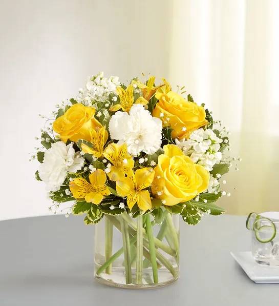 Bright Smile  - Yellow Roses, white carnations, white stock, yellow Astro, baby’s breath and variegate Pitt.