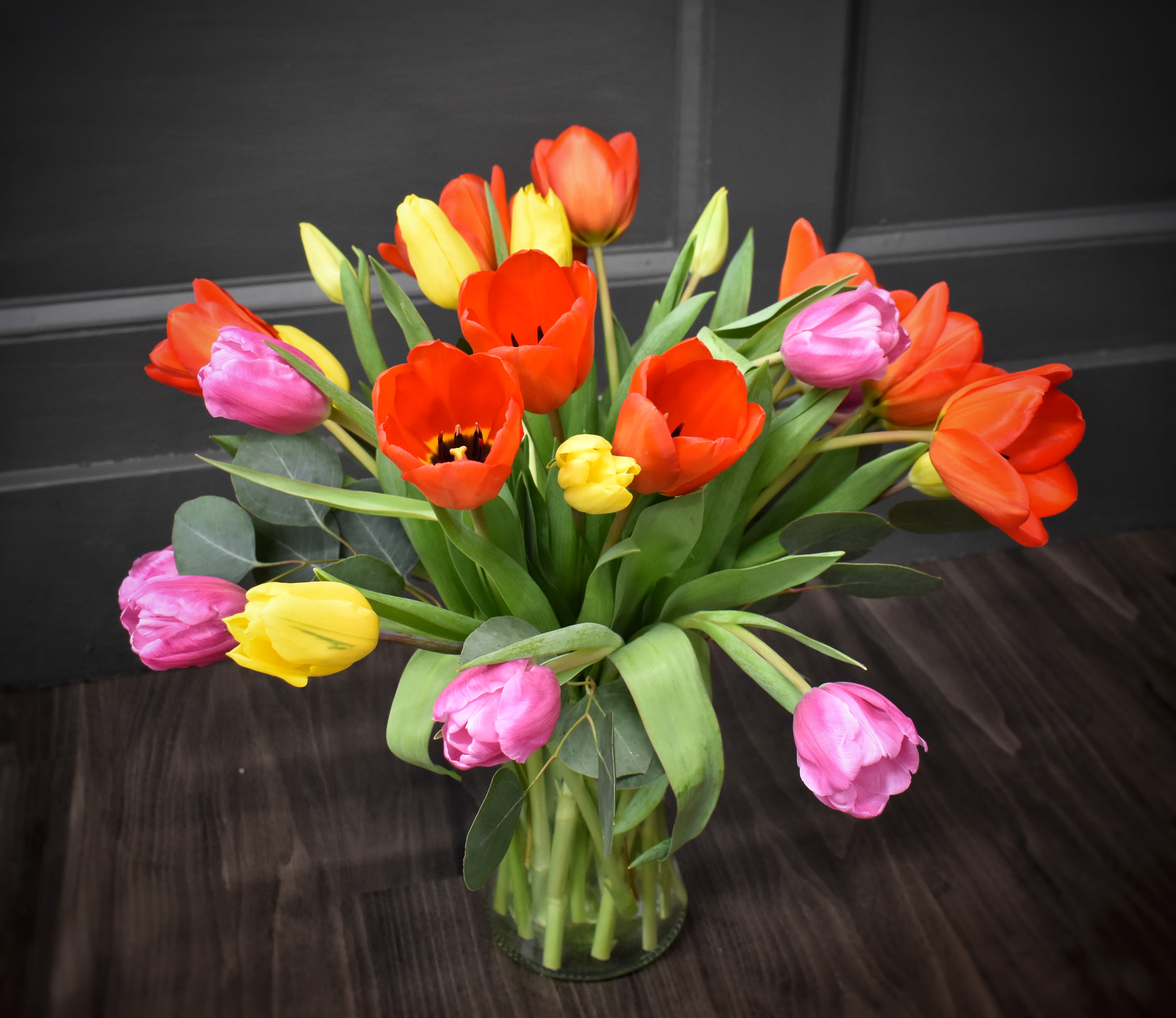 Grande Tulips - a beautiful assortment of 30 tulips is designed simply in a glass vase, a sure sign of spring!