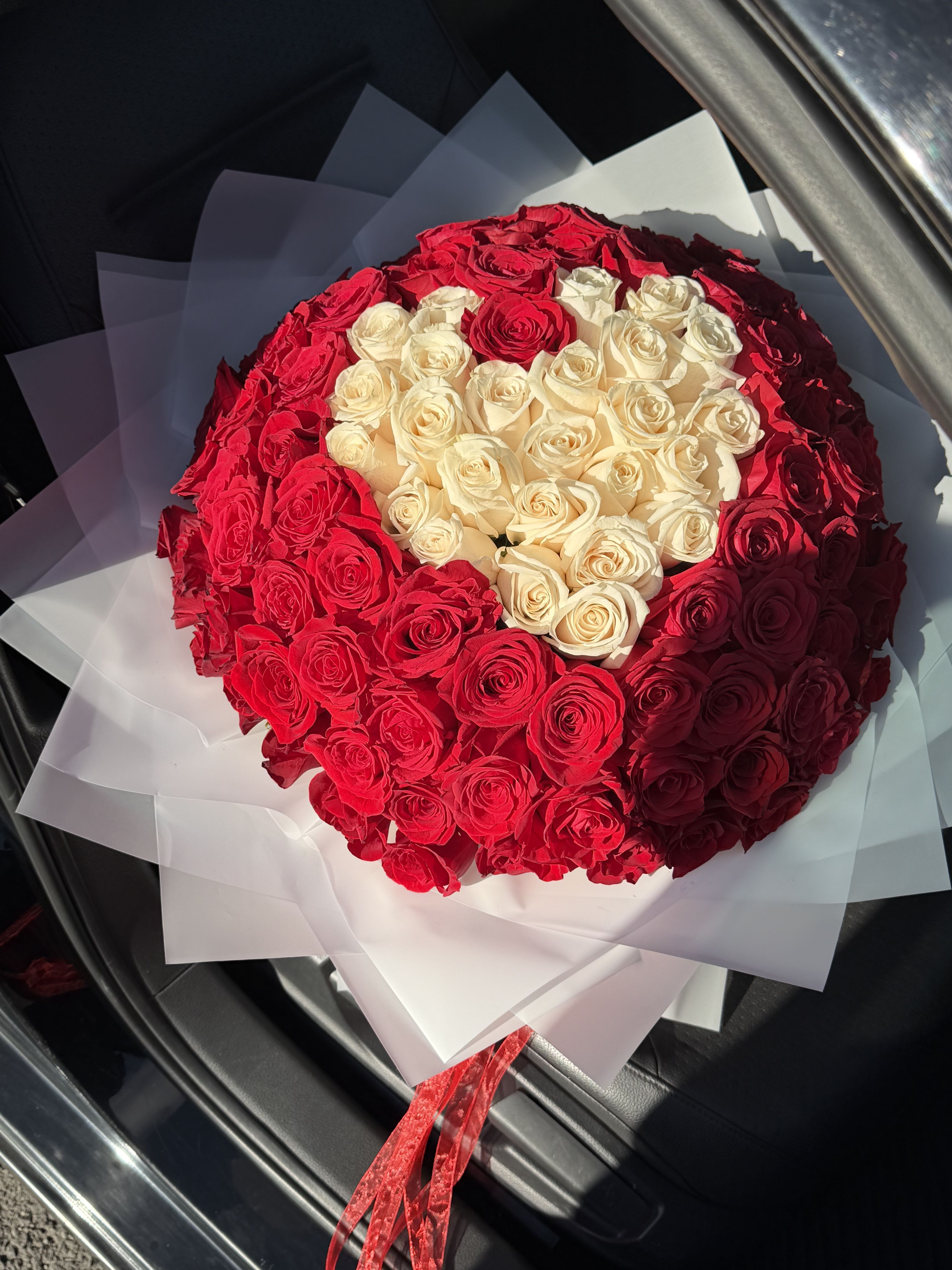 a bouquet with a heart in the middle for a proposal - A Bouquet with a Heart in the Middle for a Proposal  This exquisite bouquet is designed to make one of life’s most important questions truly unforgettable. At the center of the arrangement lies a heart-shaped design, symbolizing deep love, commitment, and the beginning of a new chapter together.  Surrounded by carefully selected fresh blooms, this bouquet represents passion, tenderness, and devotion. Every flower is placed with intention, creating a harmonious balance of elegance and emotion that speaks louder than words ever could.  Perfect for a marriage proposal, this arrangement creates a powerful visual moment — one that will be remembered forever and captured in photographs that tell a love story. Whether presented during an intimate proposal or a grand romantic gesture, this bouquet transforms the moment into a memory filled with beauty and meaning.  Crafted with premium flowers and exceptional attention to detail, this bouquet is more than a gift — it is a symbol of love, promise, and a heartfelt “yes.” 