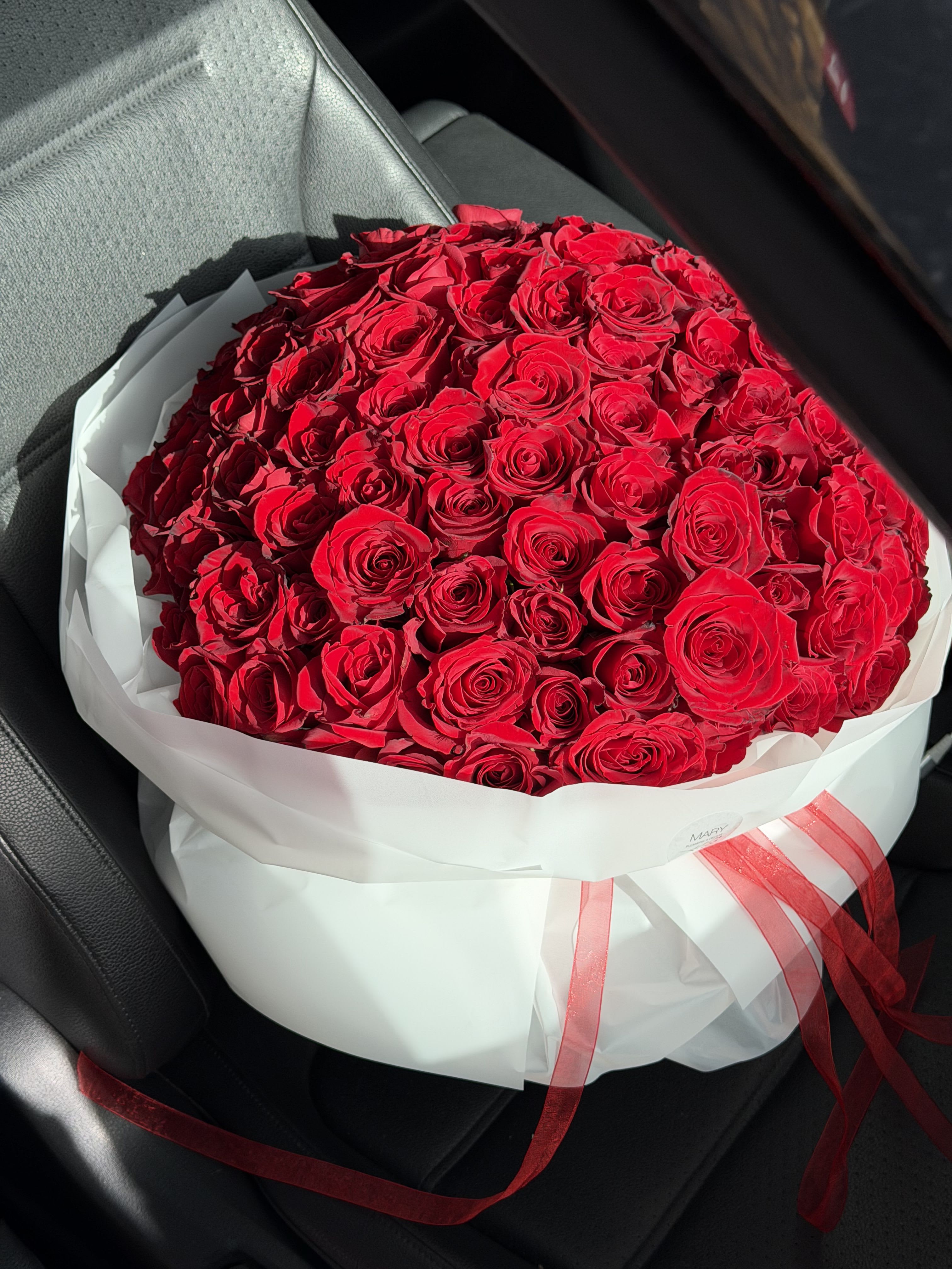 Bouquet of 75 red roses - eternal love - Immerse yourself in the world of true passion and romance with this stunning bouquet of 75 deep red roses. Each rose is a symbol of pure, sincere, and eternal love — a love that touches the heart and leaves an unforgettable impression. This bouquet is not just a gift of flowers; it’s a story of emotions, a declaration of devotion, and a timeless expression of respect and admiration for someone truly special.  Red roses have always been associated with love, passion, and the warmth of the heart. In this bouquet, every petal seems to whisper, “You are my inspiration” and “My heart belongs to you.” The arrangement is carefully crafted so that each rose blooms perfectly, creating a harmonious and luxurious volume that radiates beauty from every angle.  A bouquet of 75 roses is perfect for the most special moments — anniversaries, declarations of love, weddings, or simply to surprise and delight your beloved without any occasion. It conveys feelings that words alone often cannot express. Its grandeur and beauty captivate the heart, awakening the deepest emotions and creating an unforgettable, fairy-tale-like atmosphere.  Let these luxurious roses become your language of love — bold, passionate, and eternal. After all, true love deserves to be expressed in the most beautiful way.