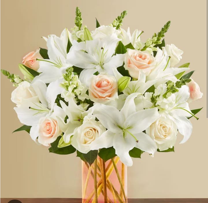 White Wishes - Send well wishes with this beautiful bouquet filled with lilies, roses, snaps, and mixed greens