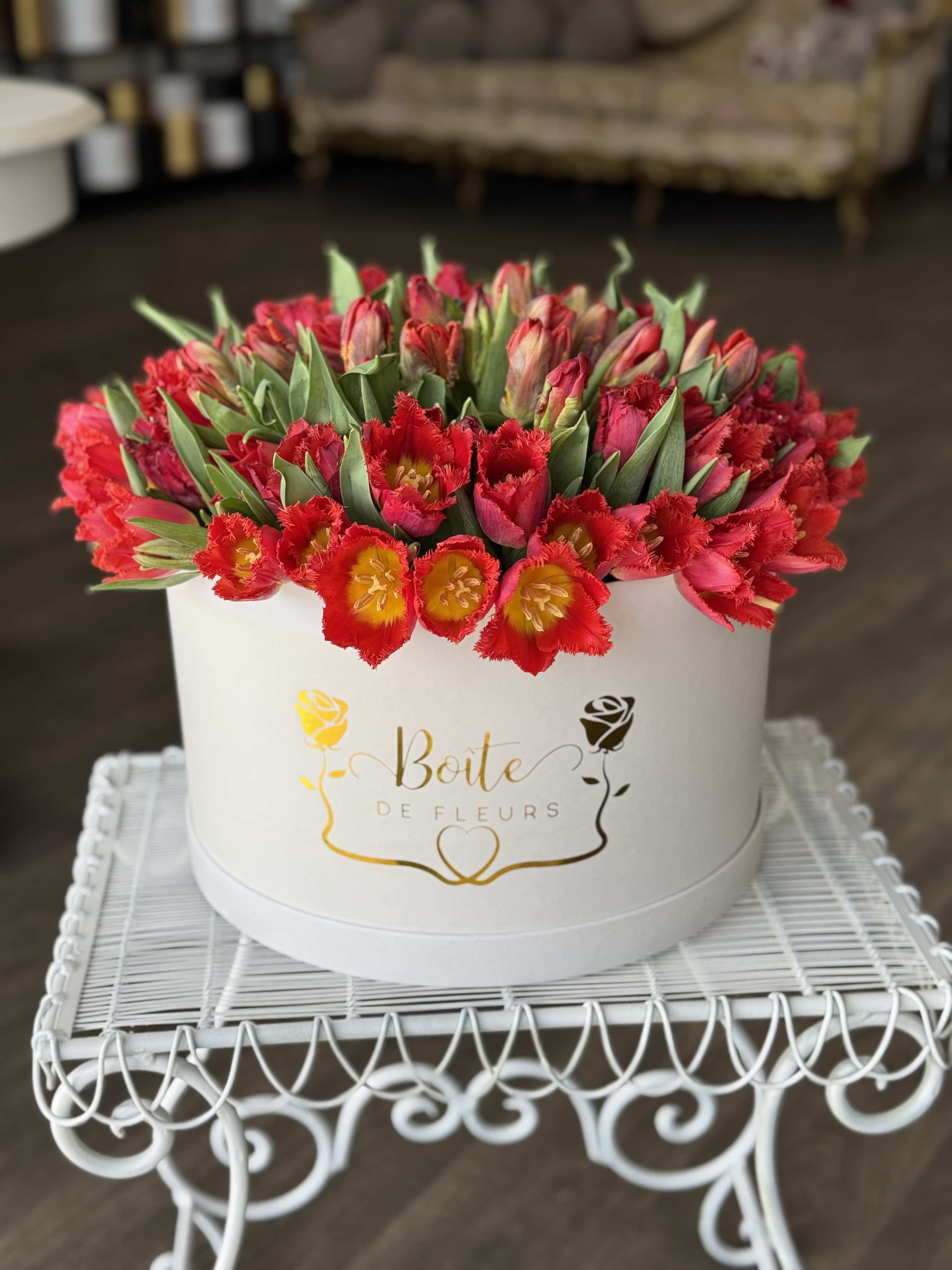 Field of Tulips - Over 90 tulips all the same color nestled in this beautiful white Boite XXL box.    **Please comment the color of the tulips you requested, if there is no request, we will create this arrangement with the freshest color tulips.