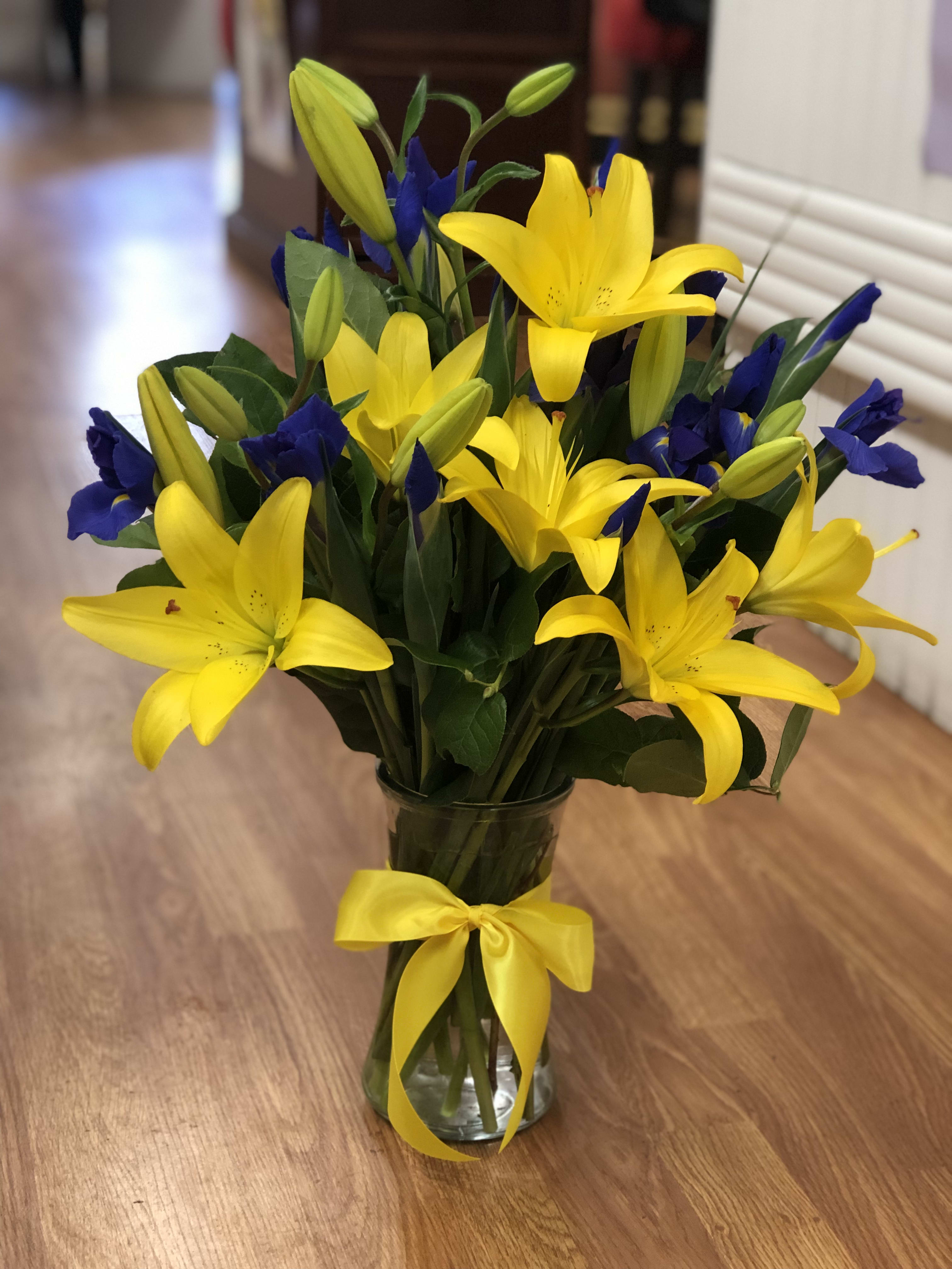 Yellow Bliss - Bright Yellow Lillies Partnered With Stems Of Purple Iris 