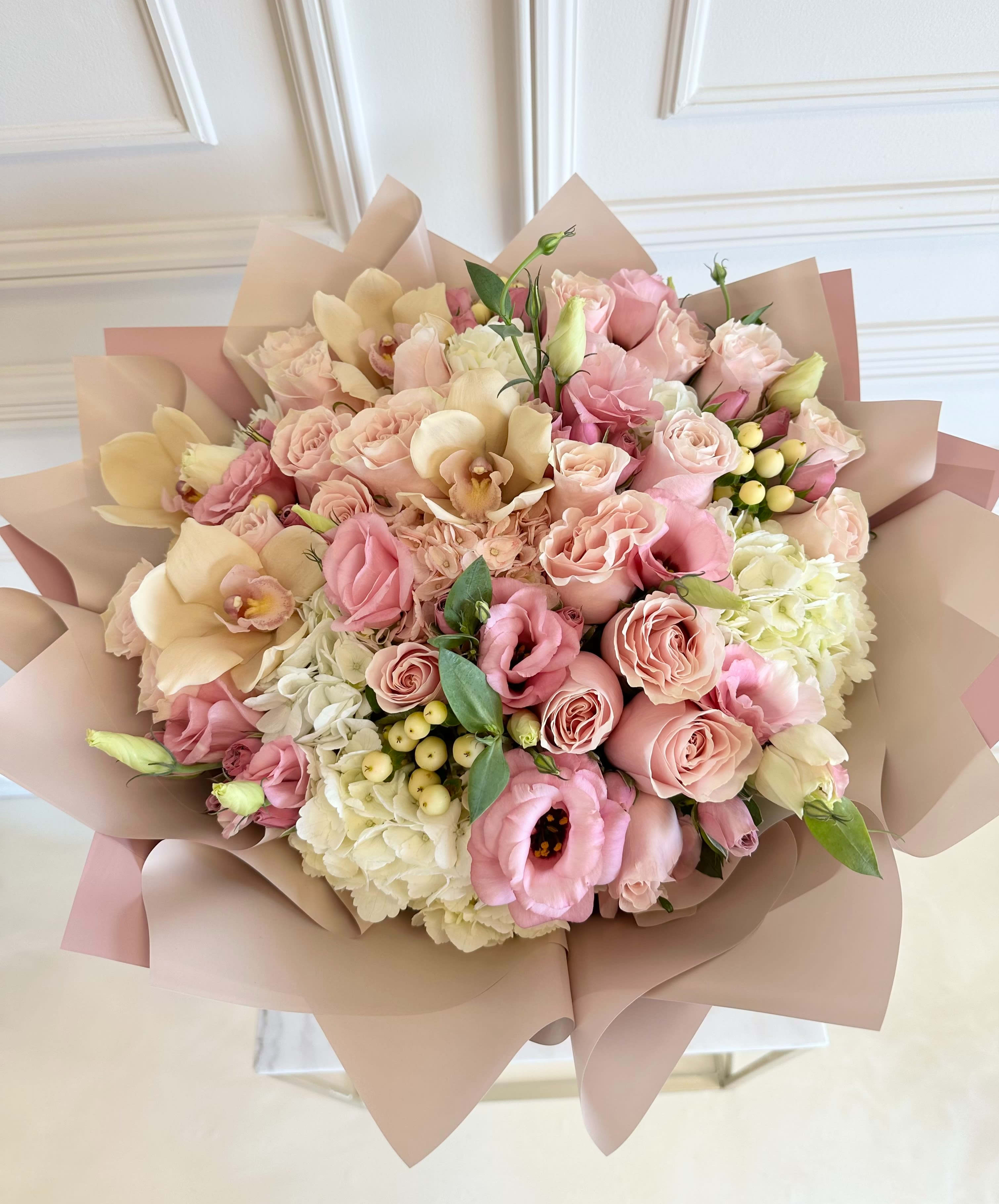 MFS Pink Blooms Bouquet  - Signature hand-tied bouquet  Hydrangeas  Roses  Orchids  Coffee beans  Lisianthus   *This bouquet does not include a glass vase