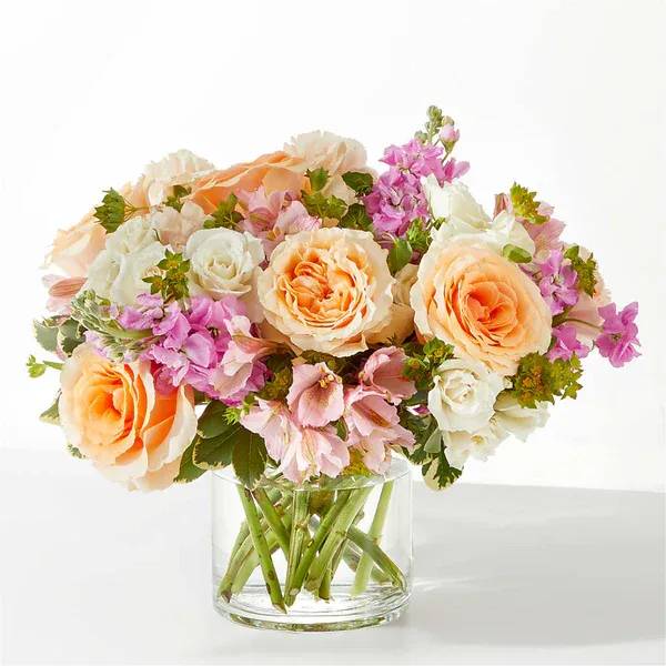 Paradise Bouquet - Relaxation and serenity can be found in the gorgeous pinks and peaches of the Paradise Bouquet.  Details The Premium Bouquet is approximately 12"H x 15"W. Designed by florists, ready to display. For long–lasting blooms, replace the water daily. We suggest trimming the stems every couple days. Pet Safety Precautions: This bouquet or plant may include flowers and foliage that are known to be toxic to pets. To keep them safe, be sure to keep this arrangement out of your pet's reach.