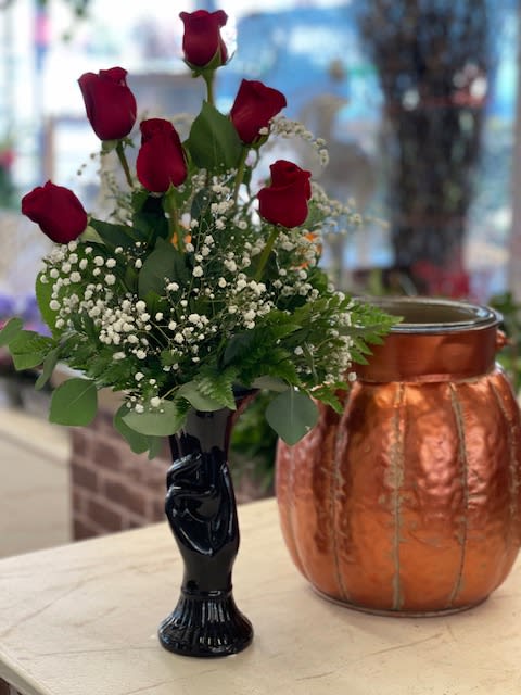 NO RED SUBS WILL BE WHITE  OR PINK - Ceramic black hand holding vase with 6 roses arranged with babies breath.