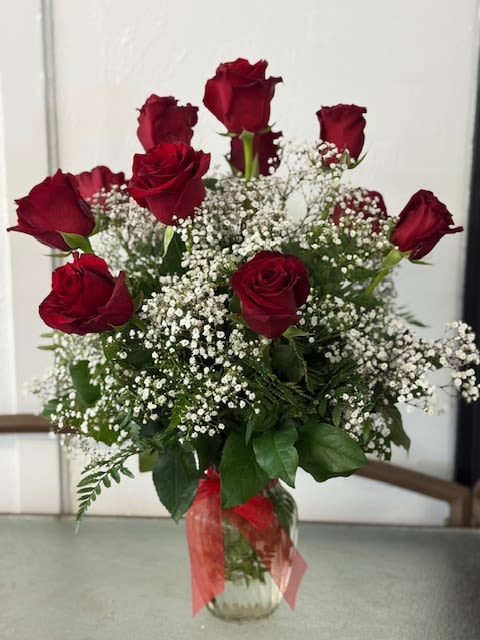 NO RED SUBS WILL BE PINK OR WHITE - Dozen roses in a traditional style with Babies breath in a glass vase
