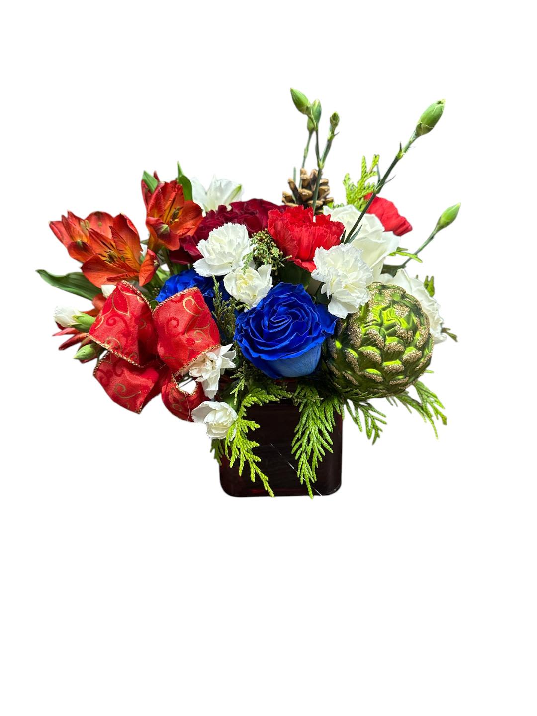 Christmas wishes 1023 - Substitution Policy  Photos show the overall style and theme of each arrangement. Some flowers or vases may vary due to seasonality, weather, or availability. If substitutions are necessary, we will maintain the design’s style, color palette, and value.  Please note any important design preferences in the florist instructions at checkout or contact us to confirm availability.  Flower Care &amp; Guarantee  We guarantee flower freshness for 24 hours after leaving our shop.  Care Tips:  Cut flowers: Trim stems and change water every 2–3 days.  Foam arrangements: Add about 1 cup of water every couple of days.  After 24 hours, proper care is the customer’s responsibility.