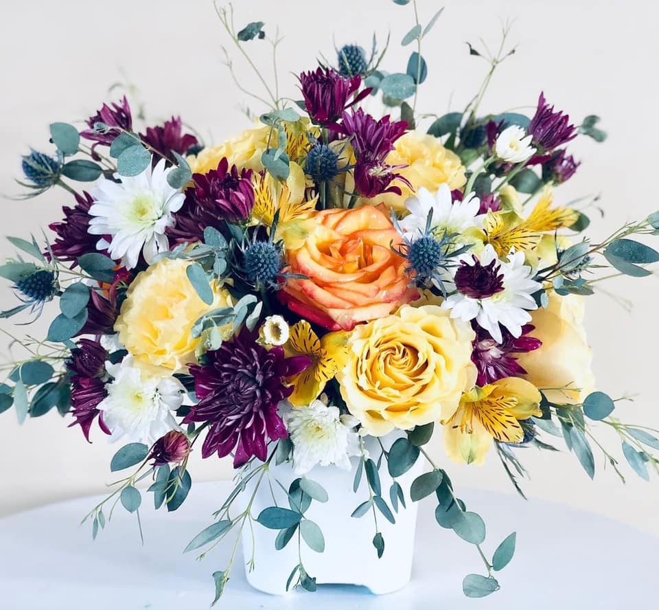 Burst of Color! - A mixed arrangement of garden varieties that burst with color. Colors of flowers will vary.