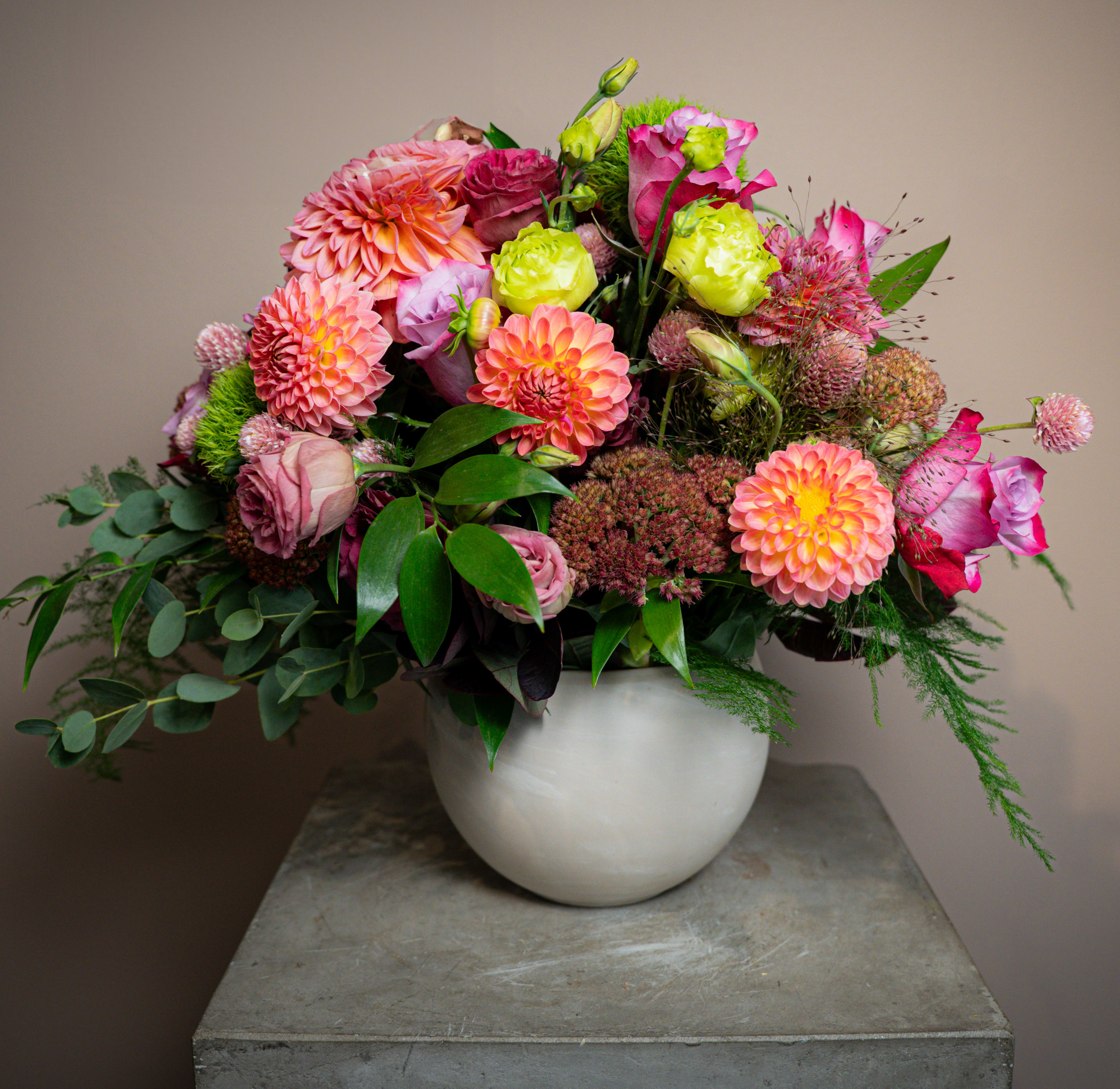 Dolce Meraviglia - This arrangement of dahlias, roses, clover, dianthus, and more brings together an impressive arrangement that is sure to impress, but not overwhelm. Not too much, not too little, it hits that sweet spot right in the middle.