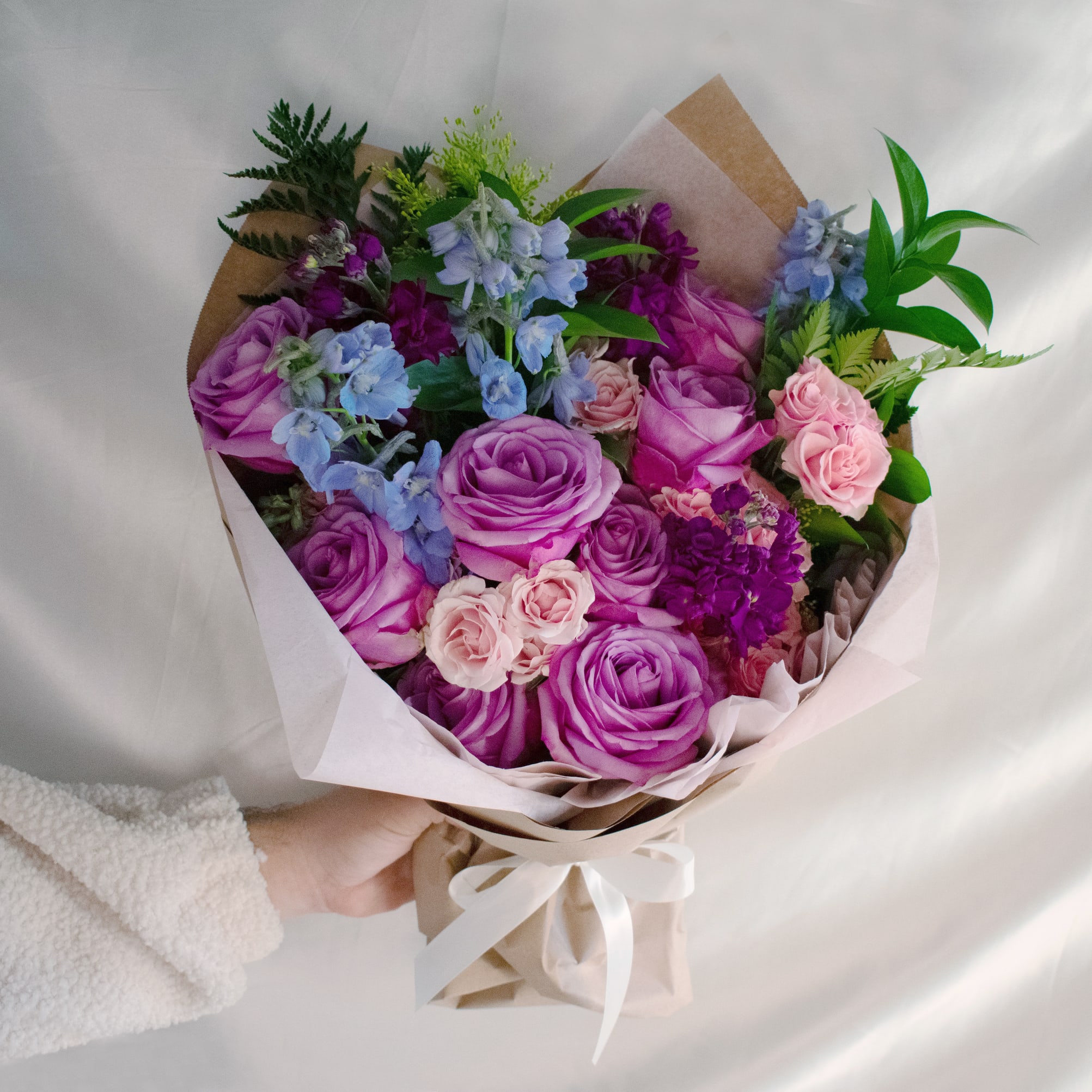 Amore Voila - Hand-Tied Bouquet with Lavender Roses - Brighten someone's day with this stunning hand-tied bouquet. Featuring elegant lavender roses, delicate spray roses, and an array of fresh flowers, this gorgeous arrangement is perfect for any special occasion. Surprise your loved ones with the beauty and charm of our expertly crafted bouquet. Order now for quick and reliable delivery!