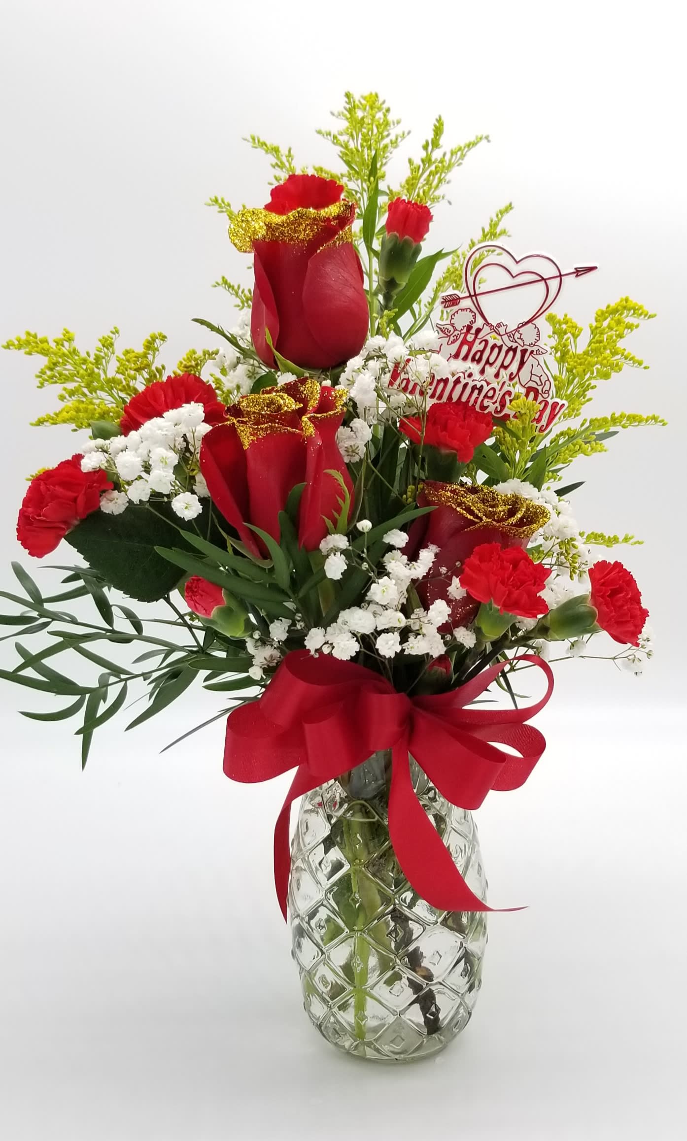 "Glitter &amp; Glam"  Vase Arrangement - A beautiful array of Glittered Gold Designer Choice Roses with greenery &amp; fillers in a Glass Vase. *Glass vase may differ from picture, upon availability.