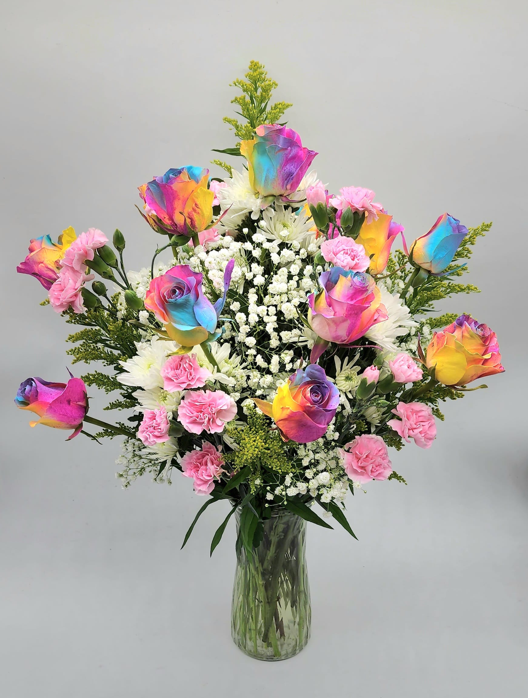 "Magically Yours Dozen Rose" Arrangement  - An array of beautiful Designer Choice Dozen roses mixed with spring flowers. Made for that special someone!