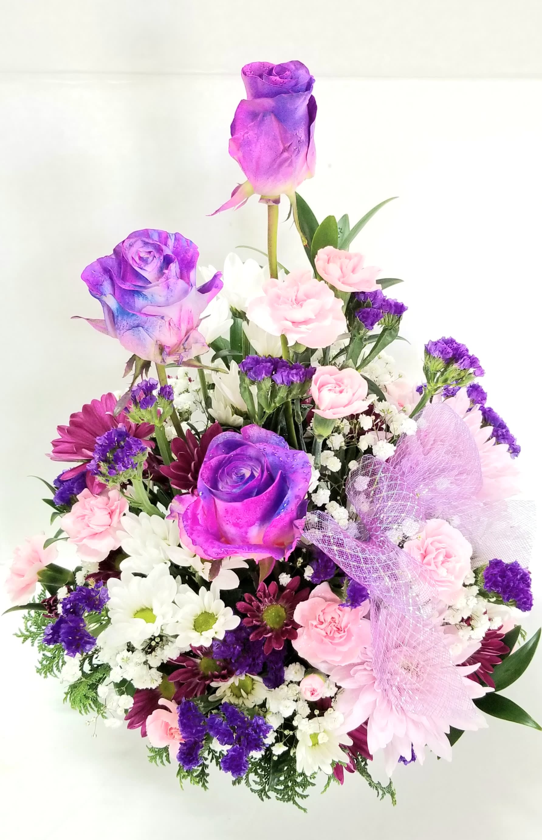 “Love You to the Moon!” Arrangement - A beautiful array of Designer Choice Galaxy Purple Roses and a mix of lavender spring flowers.