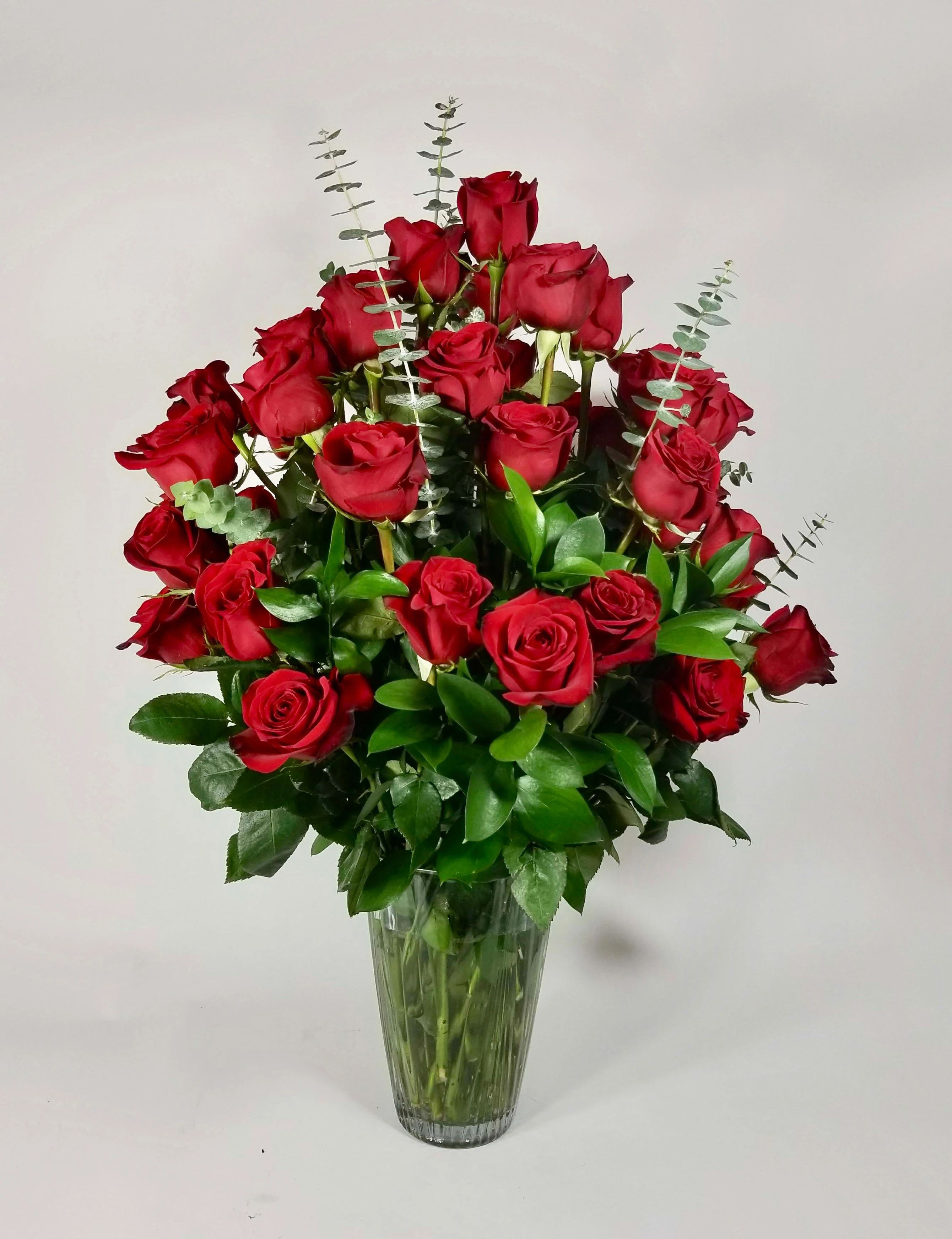 Queen of Hearts  - An arrangement in a clear vase with 36, 48 or 60 red roses 