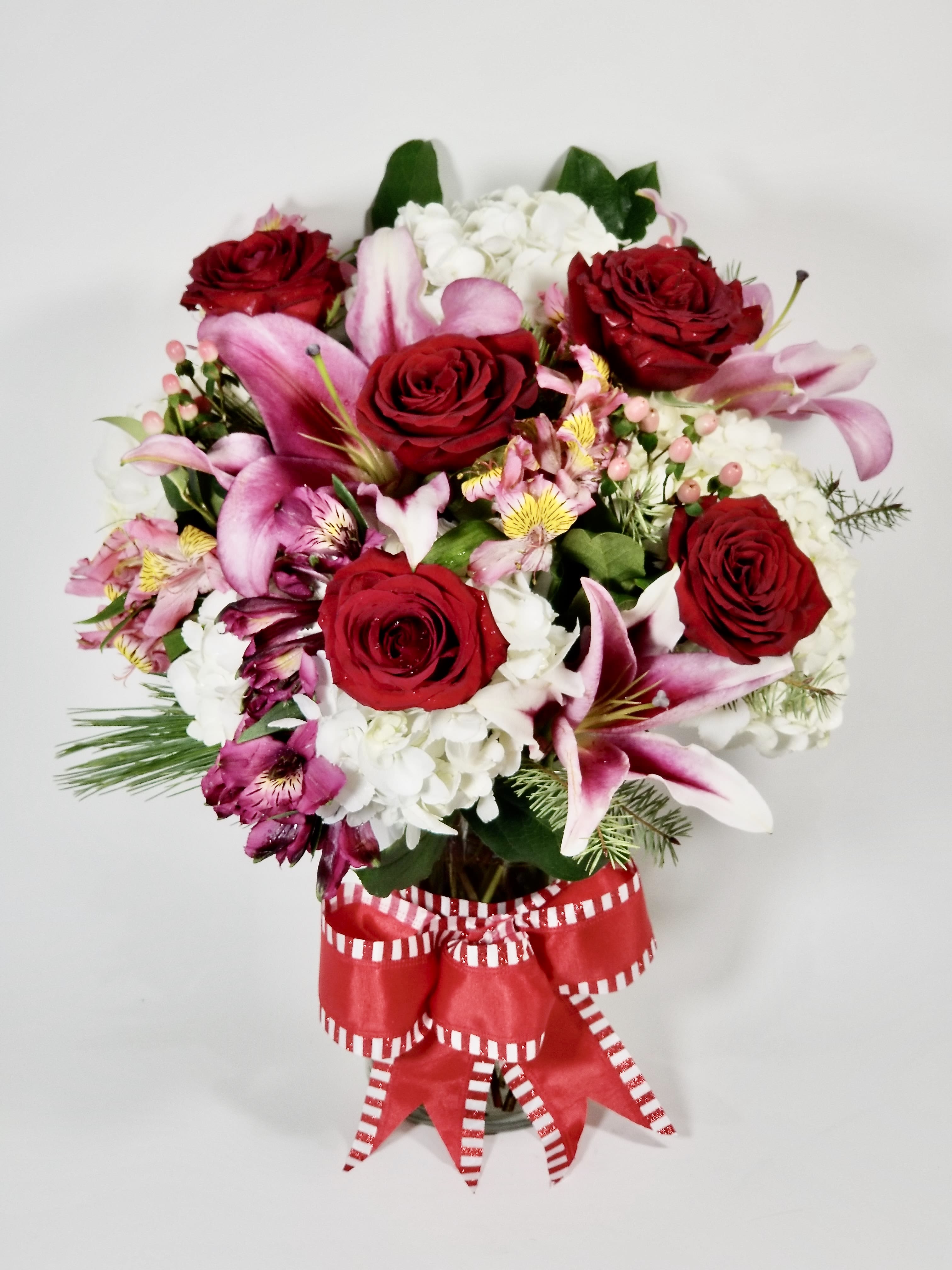 Thinking About You  - Beautiful Arrangement of Red Roses in a glass vase with Lilies, White Hydrangeas, Alstroemerias, Hypericum, and mixed Greens with a red bow. 