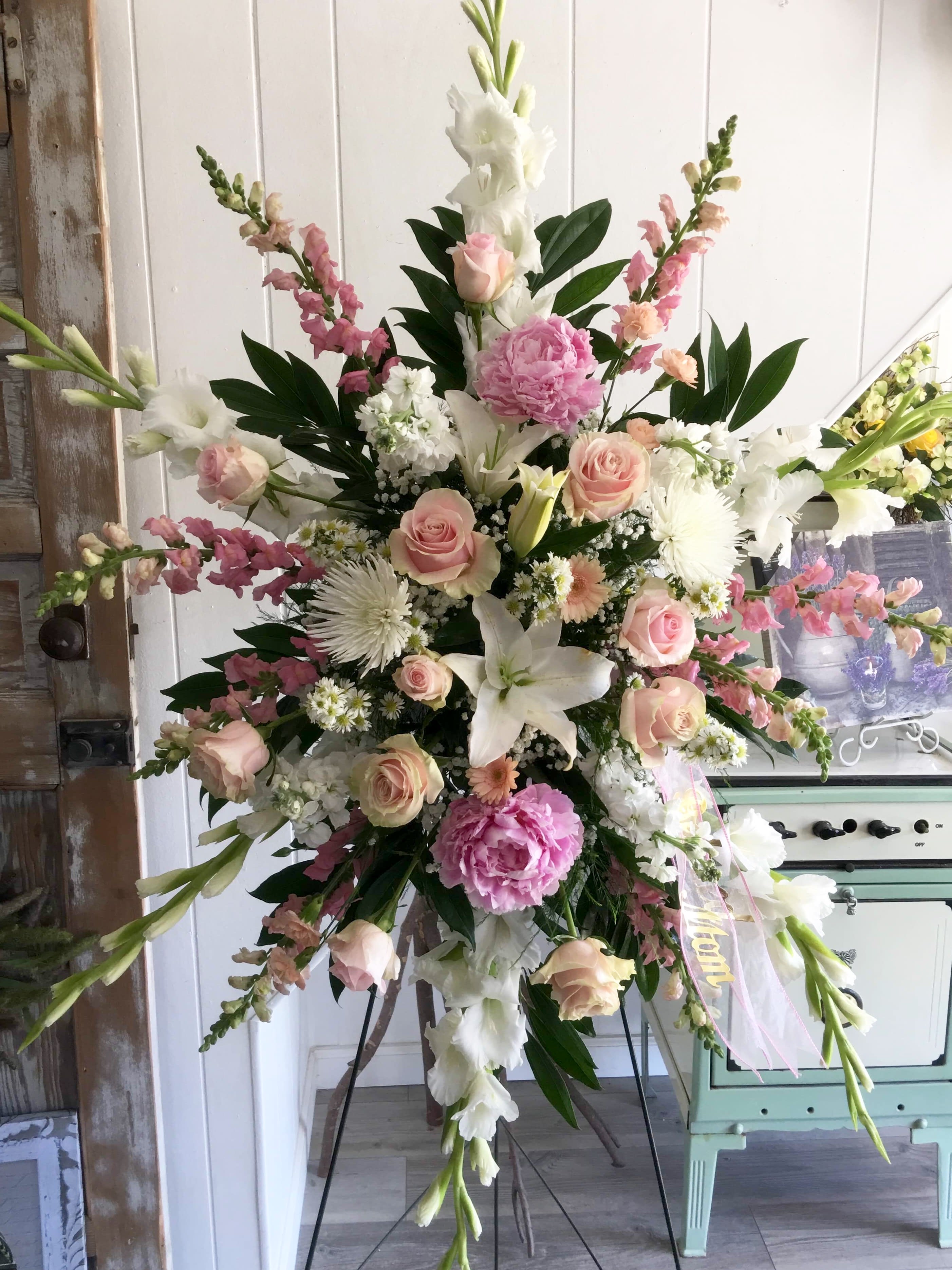 Standing Spray Tribute in Pink &amp; Blush  - *Please allow 24 to 48-hour leeway for this design.  If you need delivery today, please call me at 401-828-0701 to discuss daily flower availability.  This design is as pretty as they come.  Honor your loved one with a Large Standing Spray Tribute in Pink, Blush, Cream, and White.  So pretty!  Fresh flowers of the day will be used and may vary slightly depending on market availability.  The overall feel of the design will remain, so please feel confident your gift will be beautiful.  Please call me directly at 401-828-0701 if you prefer a different color combination.  Thank you,  Cheryl  (the pink peonies are available in summer months, only during the short growing season) 